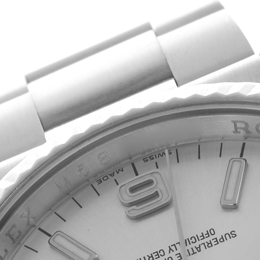 The image shows a close-up of the bezel, part of the dial, and bracelet of a Rolex Oyster Perpetual 116034 Men's Stainless Steel Silver Dial 116034 Men's Stainless Steel Silver Dial watch.