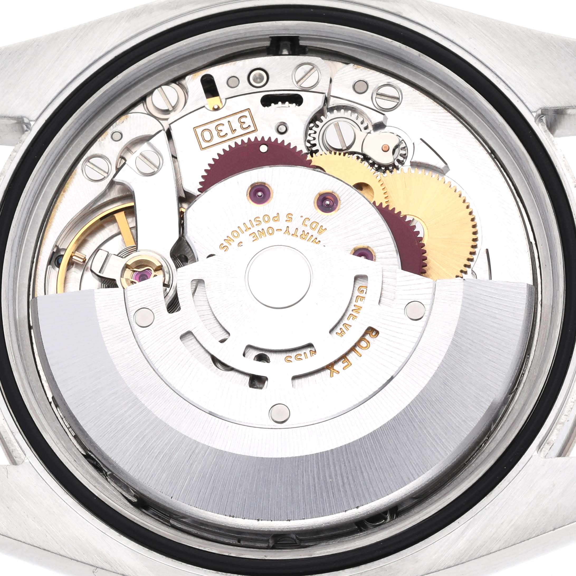 This image shows the movement and inner mechanism of a Rolex Oyster Perpetual 116034 Men's Stainless Steel Silver Dial 116034 Men's Stainless Steel Silver Dial watch from a rear angle.