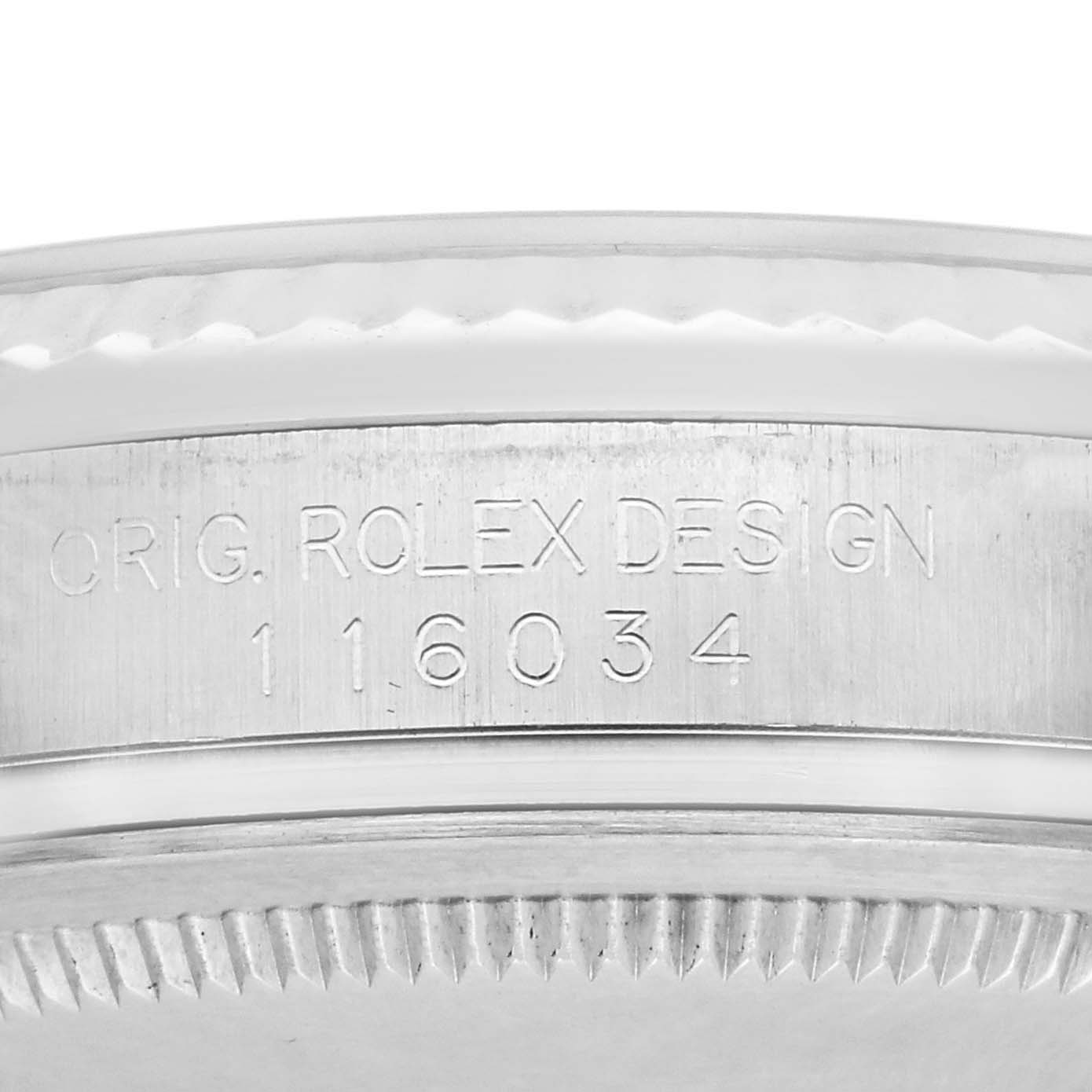 The image shows a close-up of the side of a Rolex Oyster Perpetual 116034 Men's Stainless Steel Silver Dial 116034 Men's Stainless Steel Silver Dial, focusing on the engraved model number.