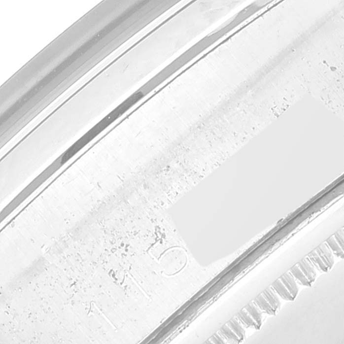 This close-up shows the engraved edge of a Rolex Vintage Collection 6694 Men's Stainless Steel Silver Dial 6694 Men's Stainless Steel Silver Dial watch case, highlighting part of the reference number.