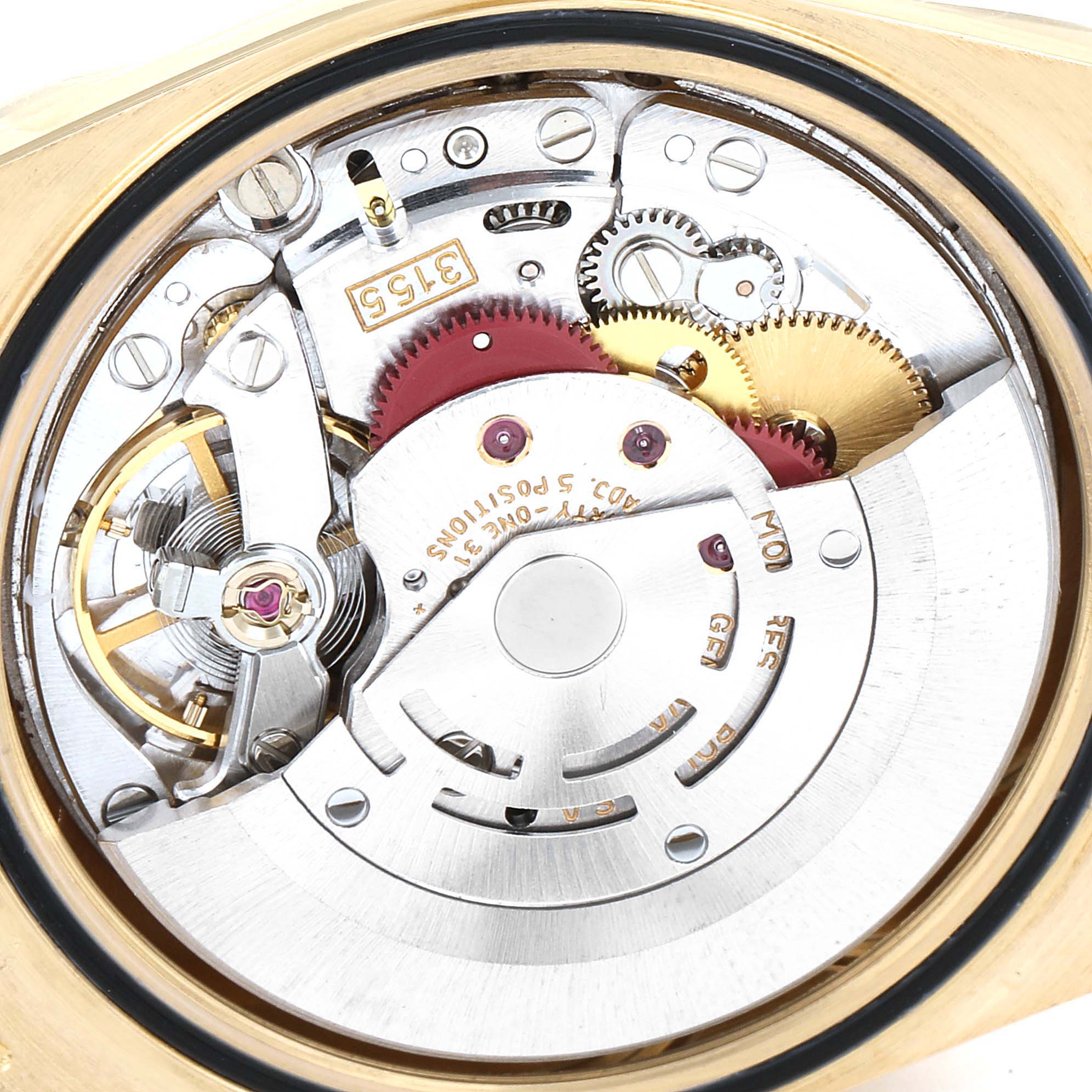 This image shows the intricate movement mechanism of a Rolex President 18238 Men
s Yellow Gold Black Dial 18238 Men
s Yellow Gold Black Dial model watch from a top-down angle.
