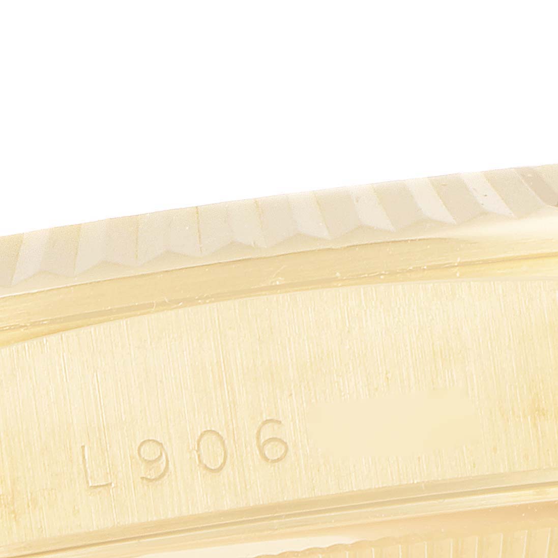 Close-up of the side of a Rolex President 18238 Men
s Yellow Gold Black Dial 18238 Men
s Yellow Gold Black Dial watch showing the engraved model number.