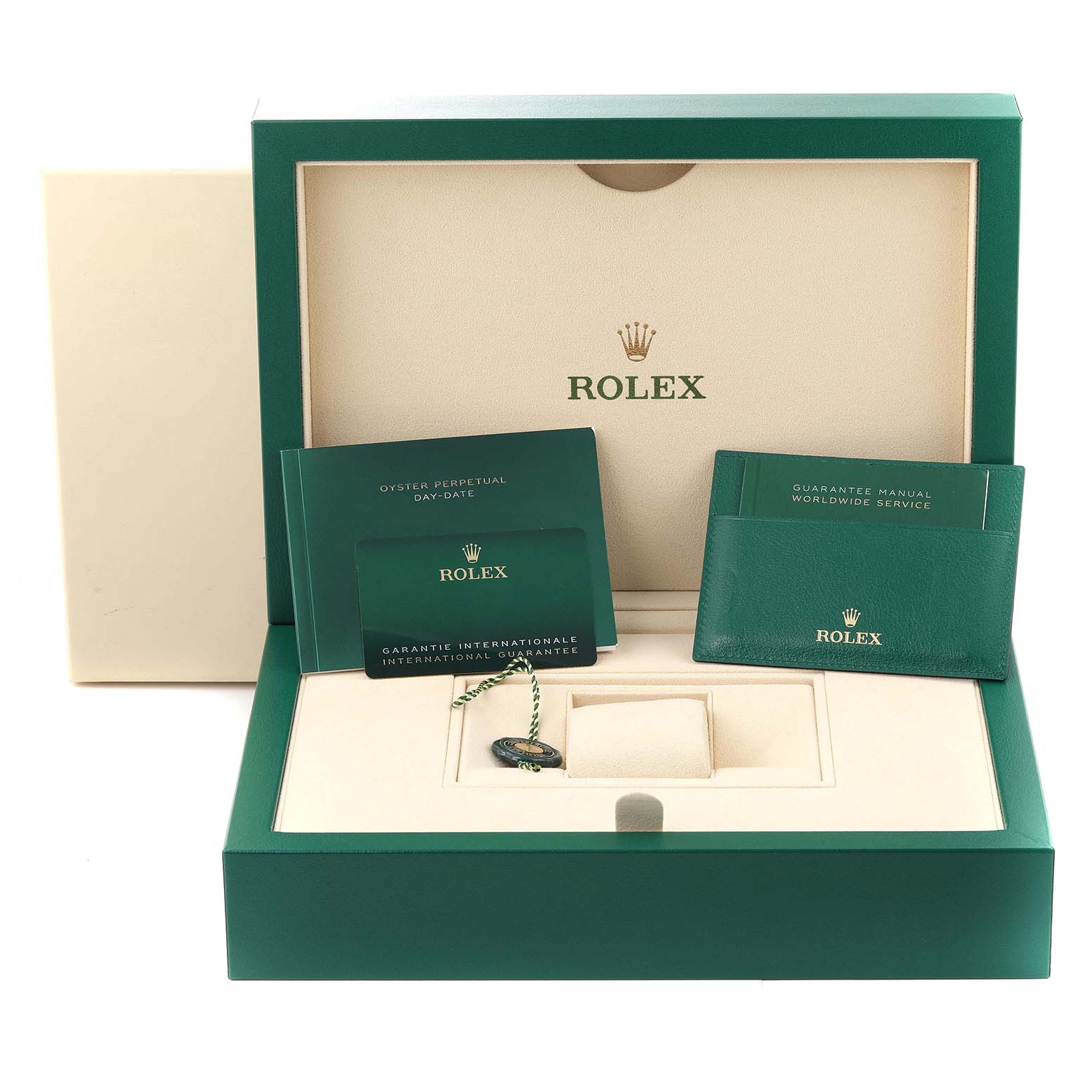 The image shows the packaging and accessories for a Rolex President 128345 Men's Rose Gold Green Dial model, including booklets, a guarantee card, and a tag.