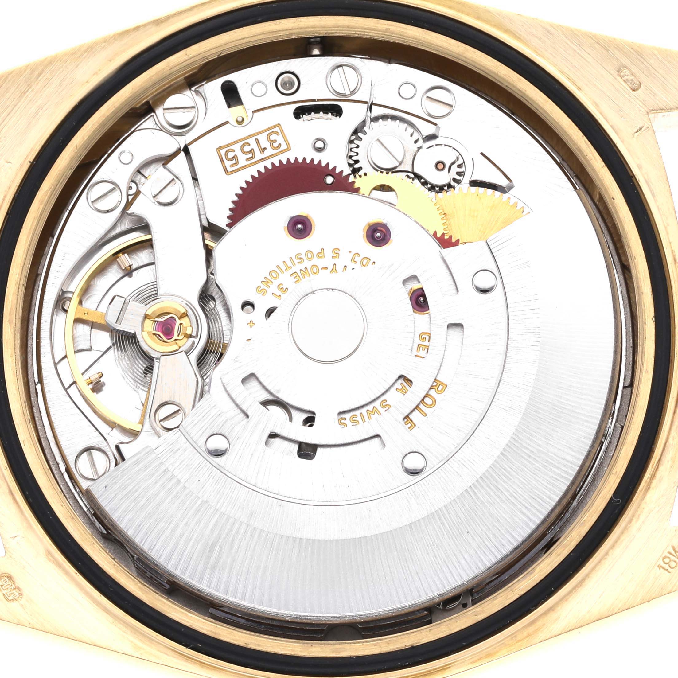 The image shows the internal mechanism of a Rolex President 18238 Men
s Yellow Gold Red Dial 18238 Men
s Yellow Gold Red Dial watch, highlighting gears and components.