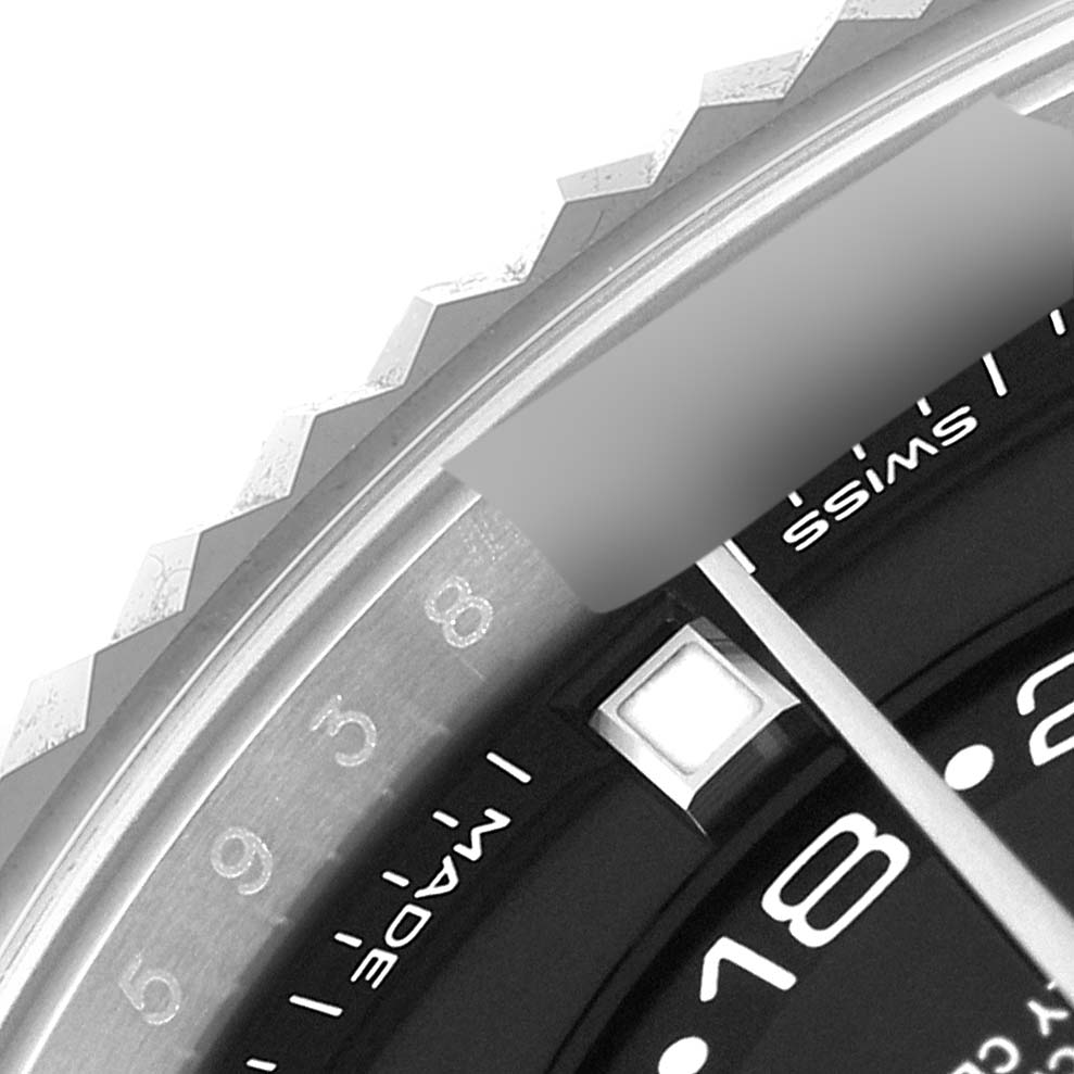 This close-up image shows the bezel, part of the dial, and hour markers of the Rolex Sky-Dweller 326934 Men's Stainless Steel Black Dial 326934 Men's Stainless Steel Black Dial watch.