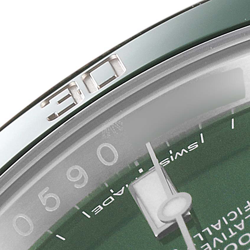 This close-up shows the green dial and part of the bezel with a "30" mark of a Rolex Submariner 116610LV Men
s Stainless Steel Green Dial 116610LV Men
s Stainless Steel Green Dial watch.
