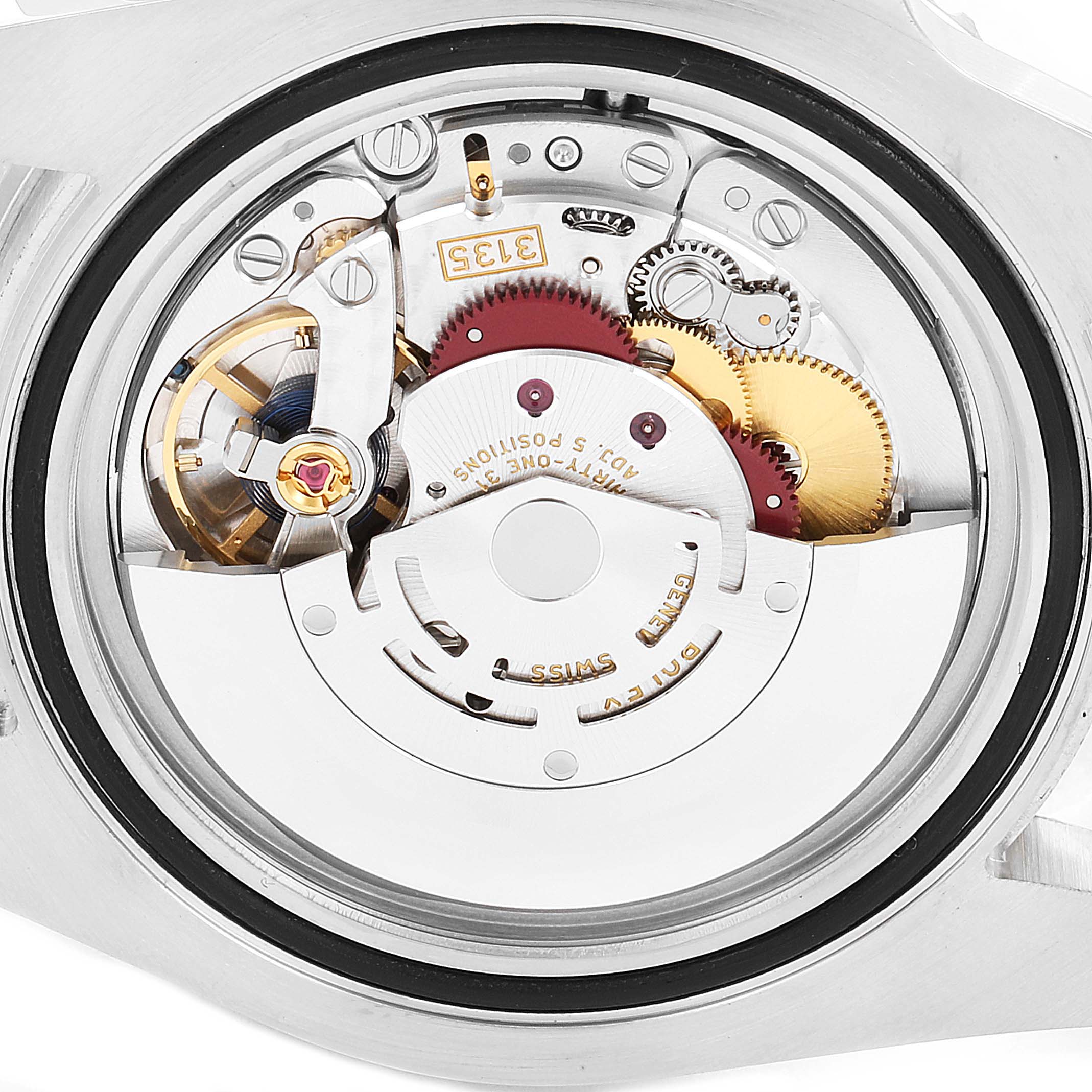 This image shows the movement mechanism of a Rolex Submariner 116610LV Men
s Stainless Steel Green Dial 116610LV Men
s Stainless Steel Green Dial watch from a back angle.