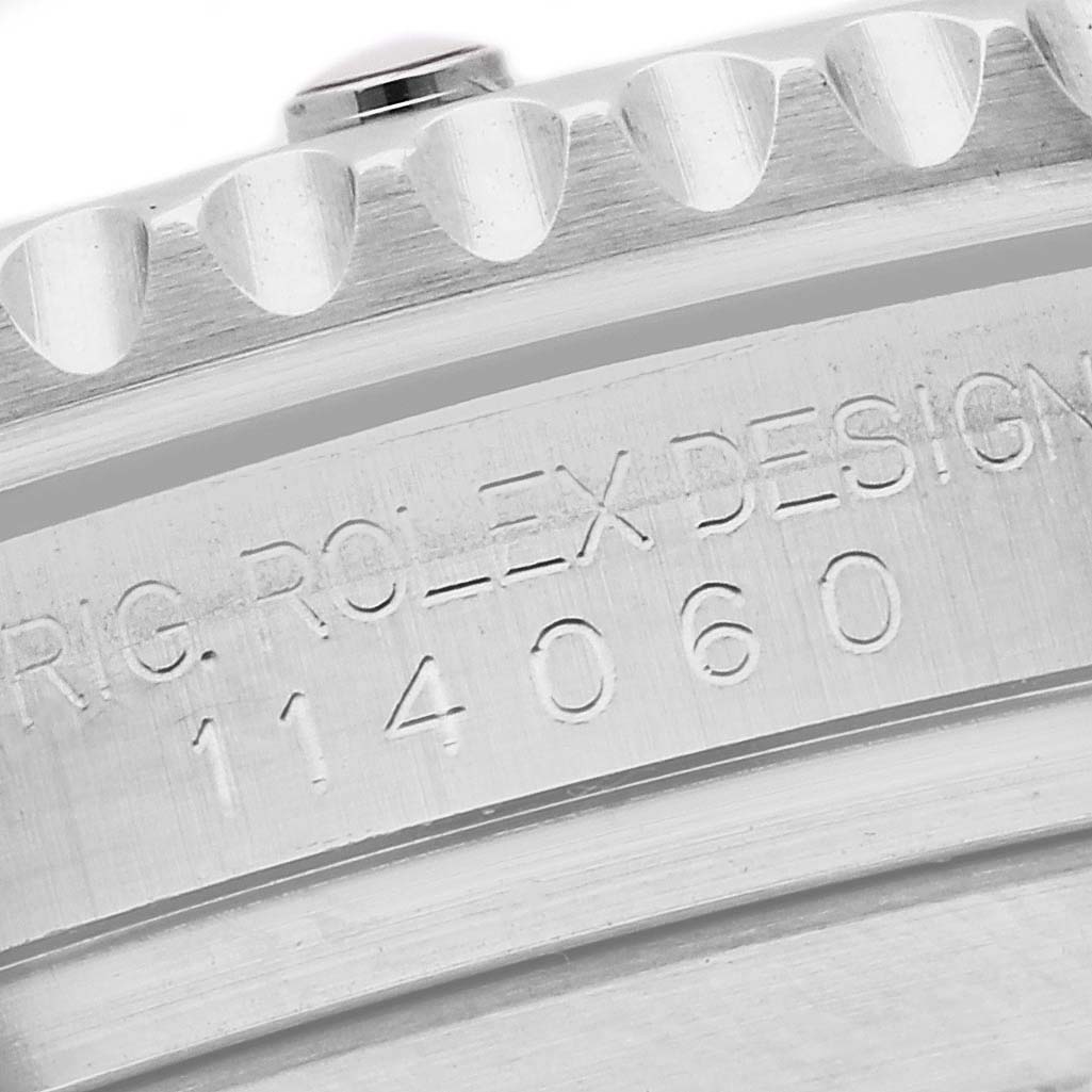 This image shows a close-up of the engraving on the case side of a Rolex Submariner 114060 Men
s Stainless Steel Black Dial 114060 Men
s Stainless Steel Black Dial.