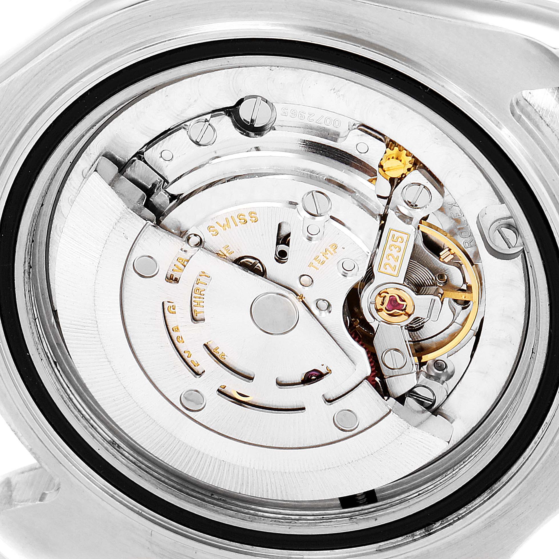 The image shows a close-up of the intricate inner mechanism of a Rolex Yacht-Master 168623 Women's Steel and Gold (two tone) Blue Dial 168623 Women's Steel and Gold (two tone) Blue Dial watch.