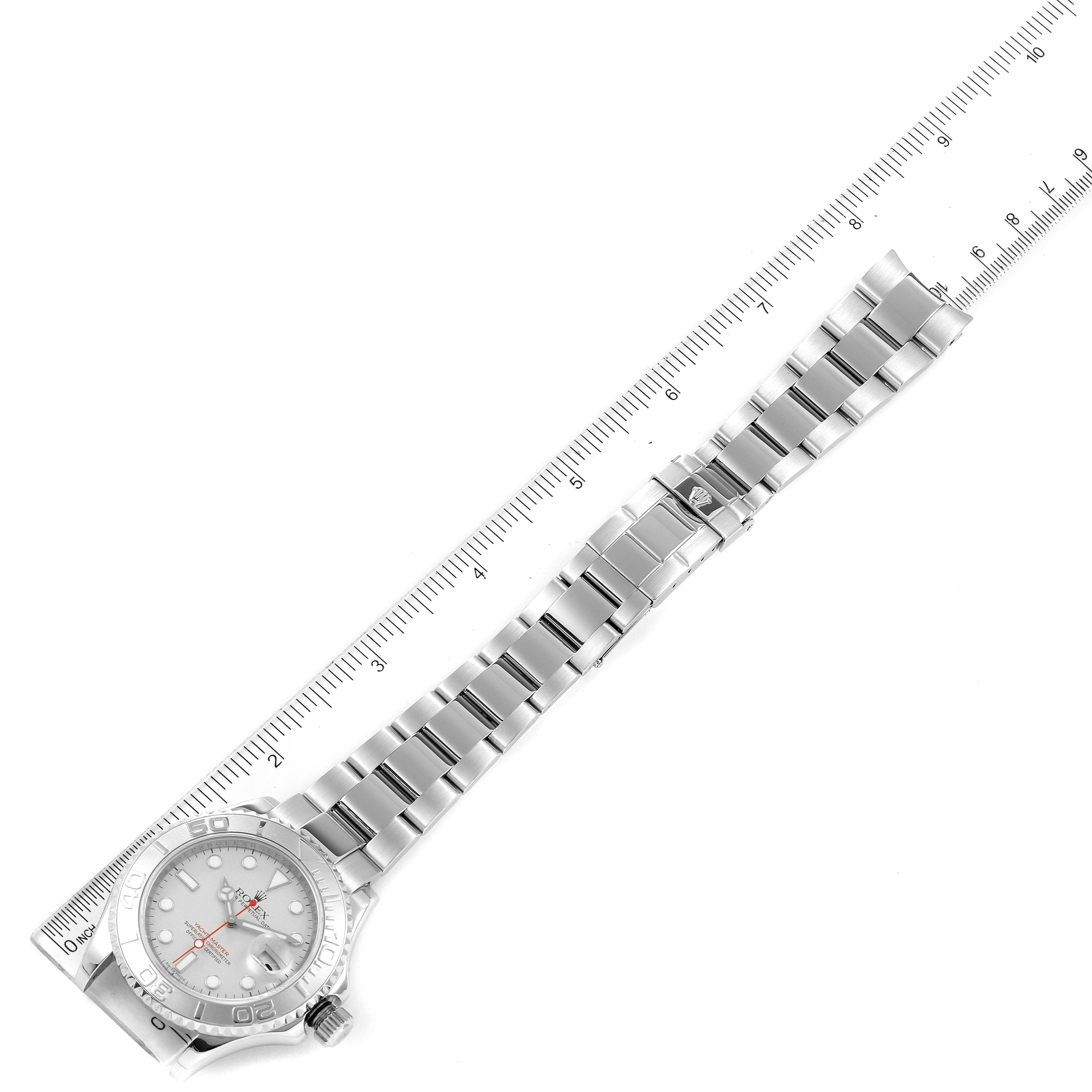 The image shows a top-down view of a Rolex Yacht-Master 16622 Men's Stainless Steel Silver Dial 16622 Men's Stainless Steel Silver Dial watch, including its face, bezel, and bracelet, next to a ruler for scale.
