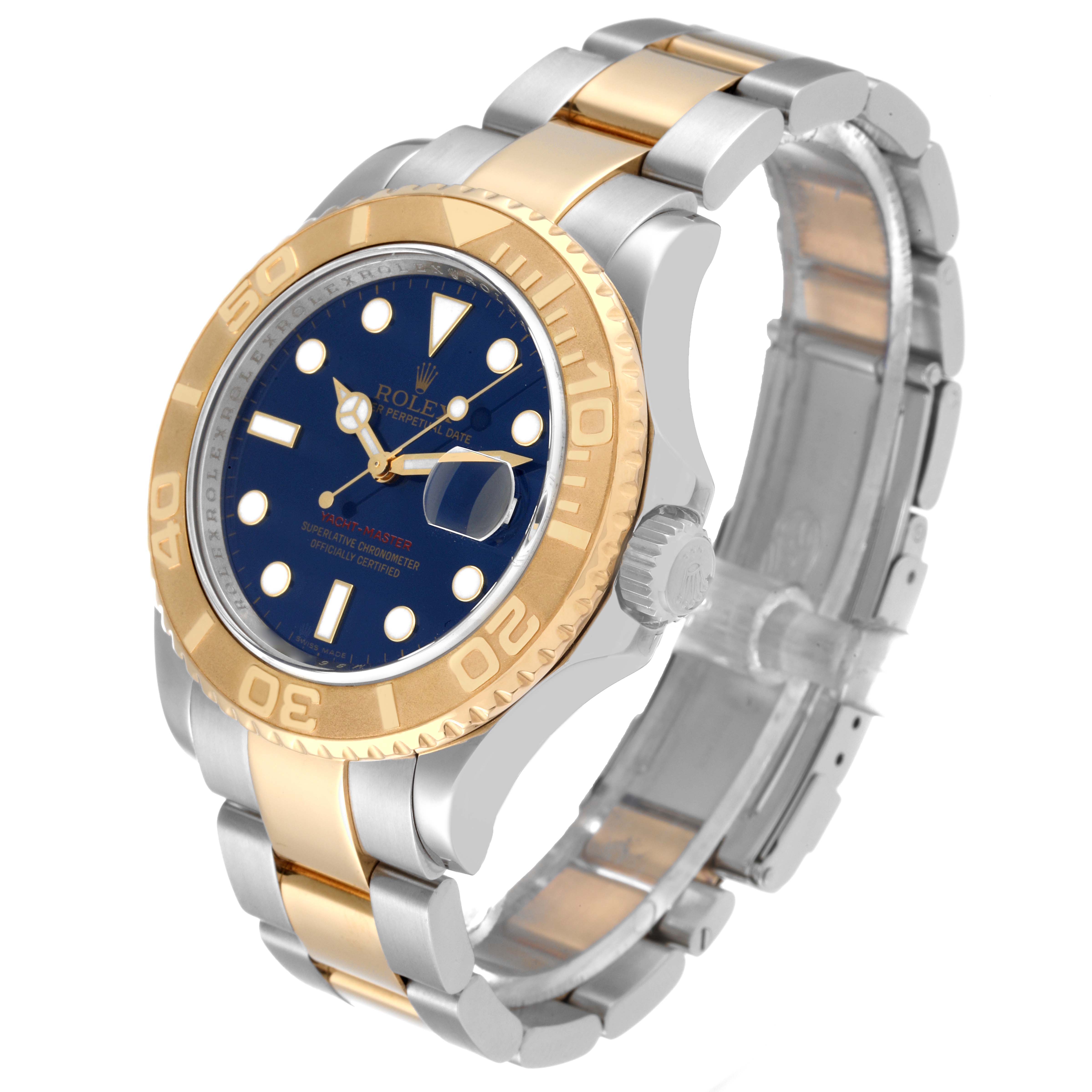 The image shows a Rolex Yacht-Master 16623 Men's Steel and Gold (two tone) Blue Dial 16623 Men's Steel and Gold (two tone) Blue Dial watch at a slight angle, highlighting its blue dial, gold bezel, and two-tone metal bracelet.