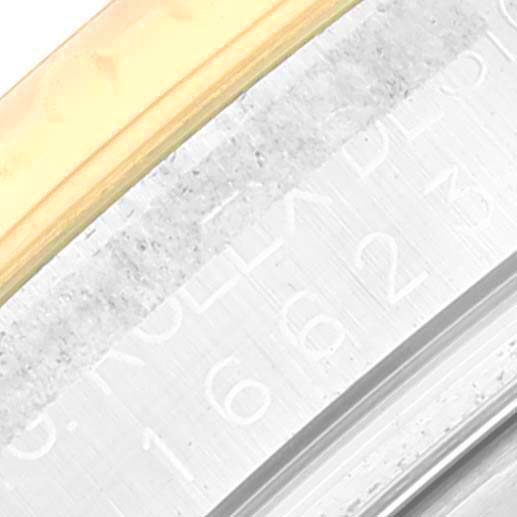 This image shows a close-up angle of the bezel and part of the rehaut of a Rolex Yacht-Master 16623 Men's Steel and Gold (two tone) Blue Dial 16623 Men's Steel and Gold (two tone) Blue Dial watch.