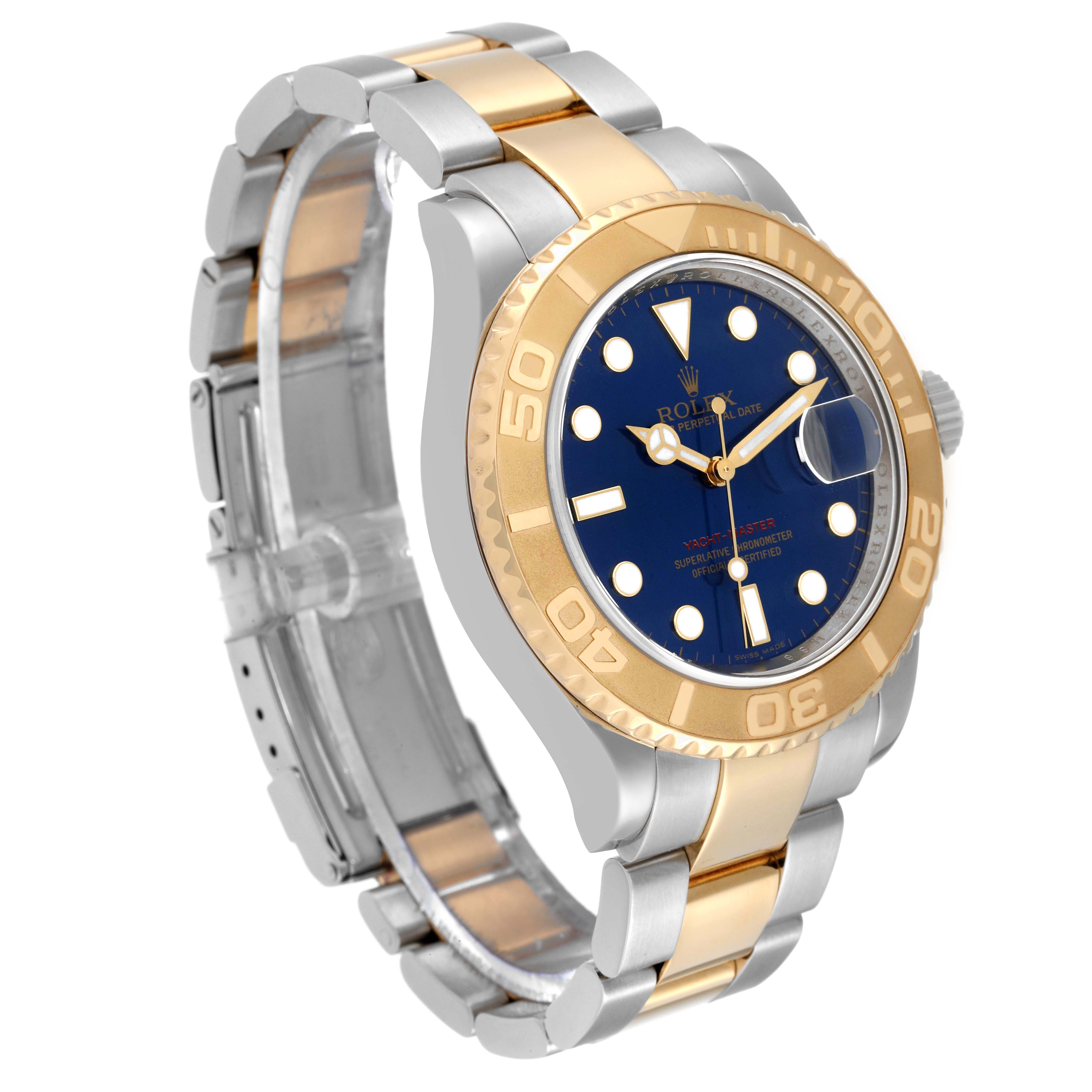 The Rolex Yacht-Master 16623 Men's Steel and Gold (two tone) Blue Dial 16623 Men's Steel and Gold (two tone) Blue Dial watch is shown at an angle displaying the bezel, dial, bracelet, and case.