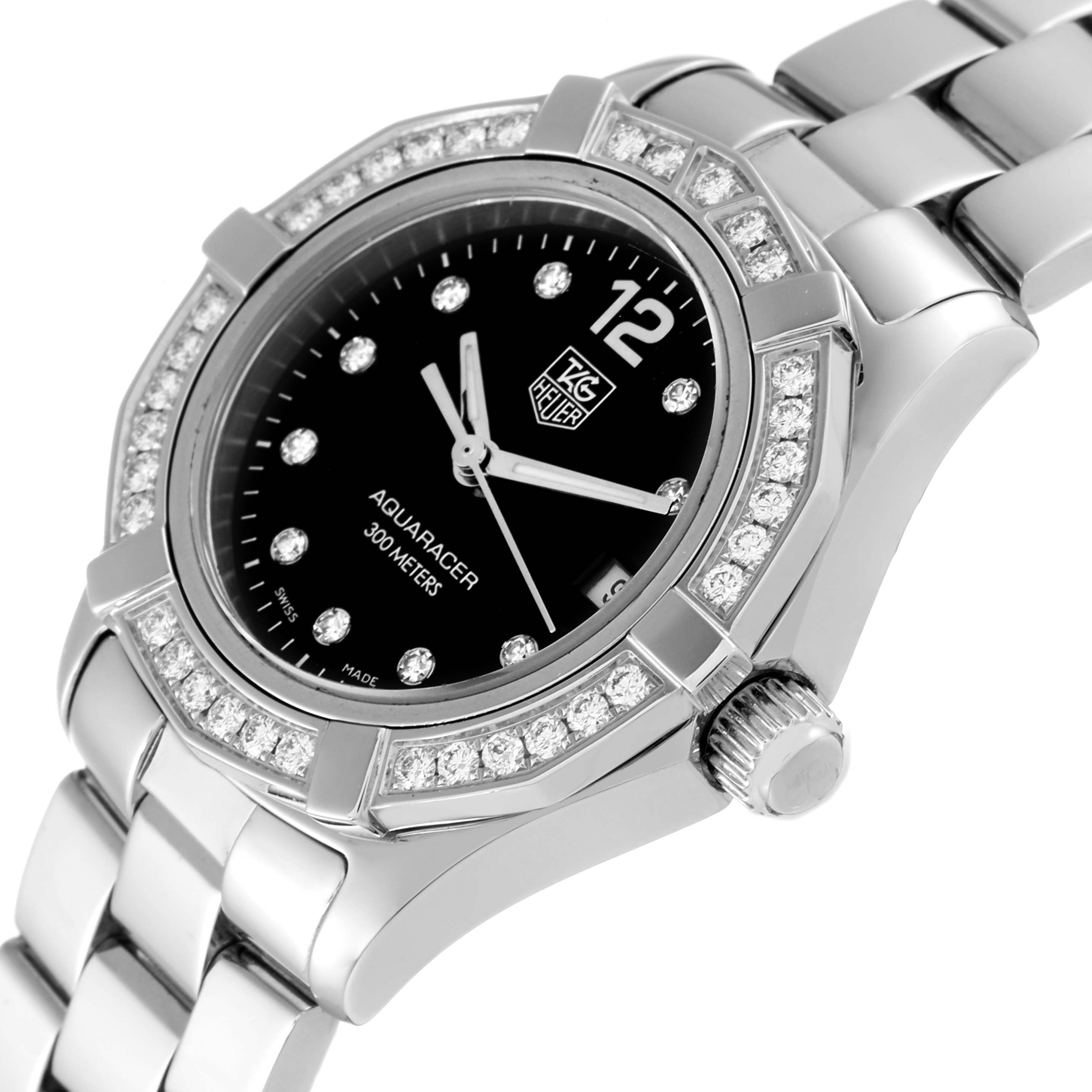 This is a close-up of the Tag Heuer Aquaracer WAF141D Women's Stainless Steel Black Dial WAF141D Women's Stainless Steel Black Dial watch dial, crown, and part of the bracelet, viewed at a slight angle.