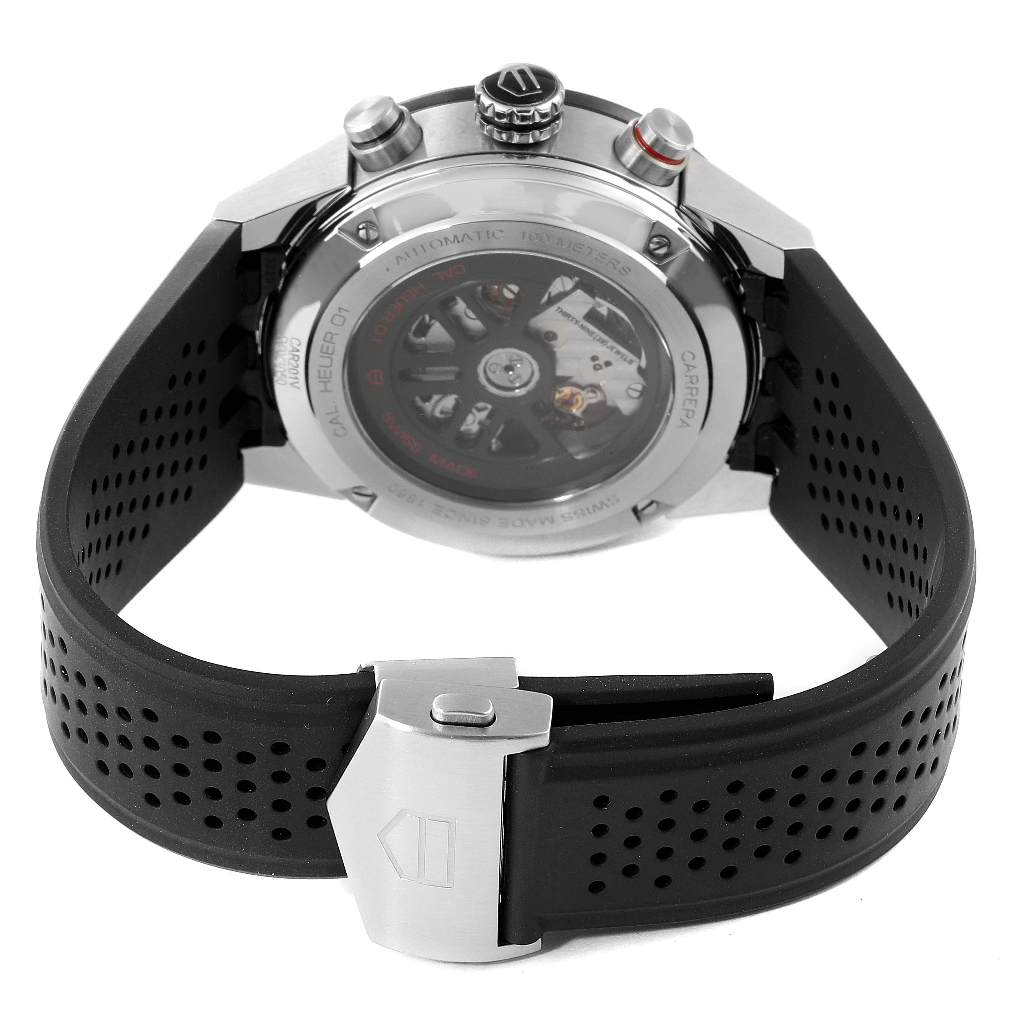 The image shows the back view of a Tag Heuer Carrera CAR201V.BA0714 Men's Stainless Steel Black Dial CAR201V.BA0714 Men's Stainless Steel Black Dial watch, highlighting the transparent case back, crown, pushers, and perforated strap with a clasp.