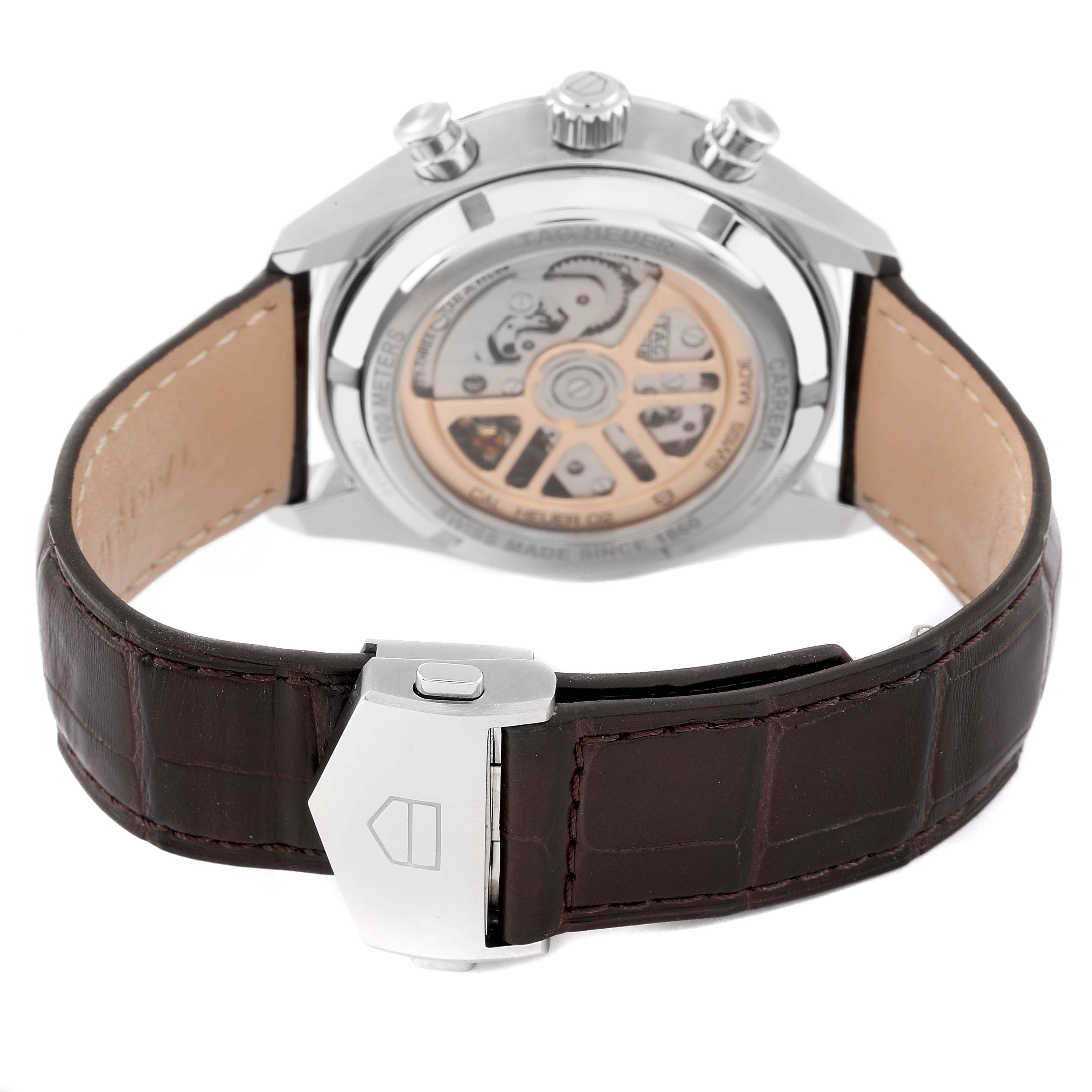 The image shows the back of a Tag Heuer Carrera CBN2013.FC6483 Men's Stainless Steel Silver Dial CBN2013.FC6483 Men's Stainless Steel Silver Dial watch, highlighting its exposed automatic movement and leather strap with clasp.