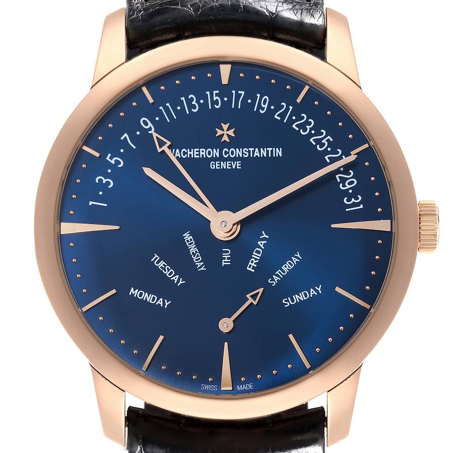 The Vacheron Constantin Patrimony watch is shown from a front angle, displaying its blue dial, gold hands, and indices clearly.