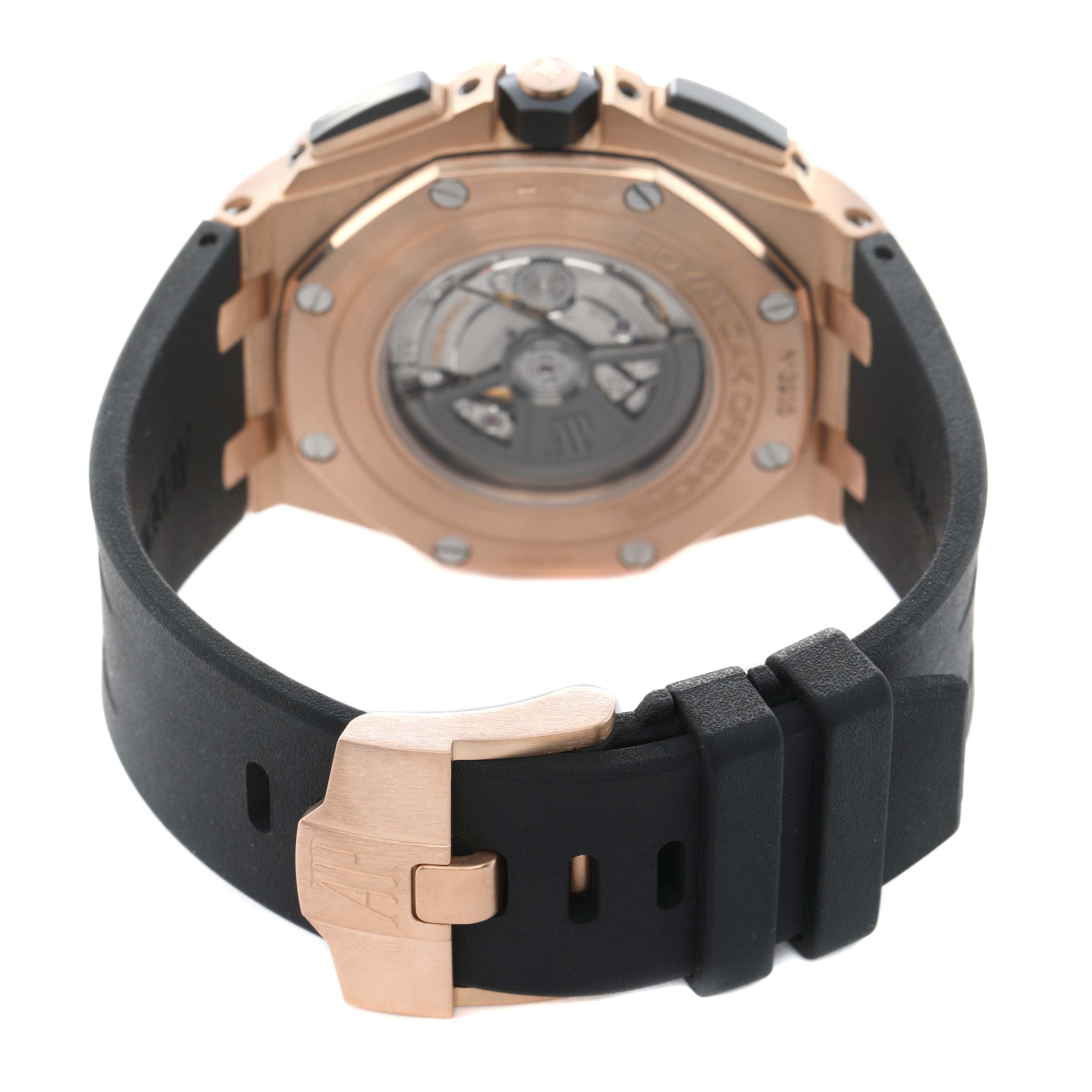 The image shows the back of the Audemars Piguet Royal Oak Offshore 26401RO Men's Rose Gold Black Dial watch, displaying the rotor and clasp on the strap.