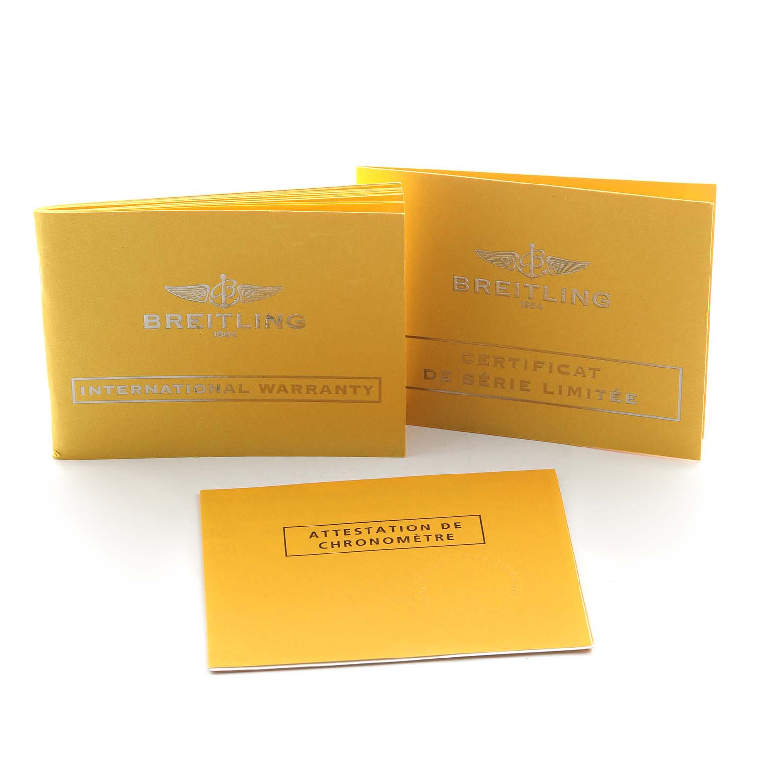 The image shows Breitling Chronomat AB0110 Men's Stainless Steel Mother of Pearl Dial watch accessories, including warranty and certificate booklets.