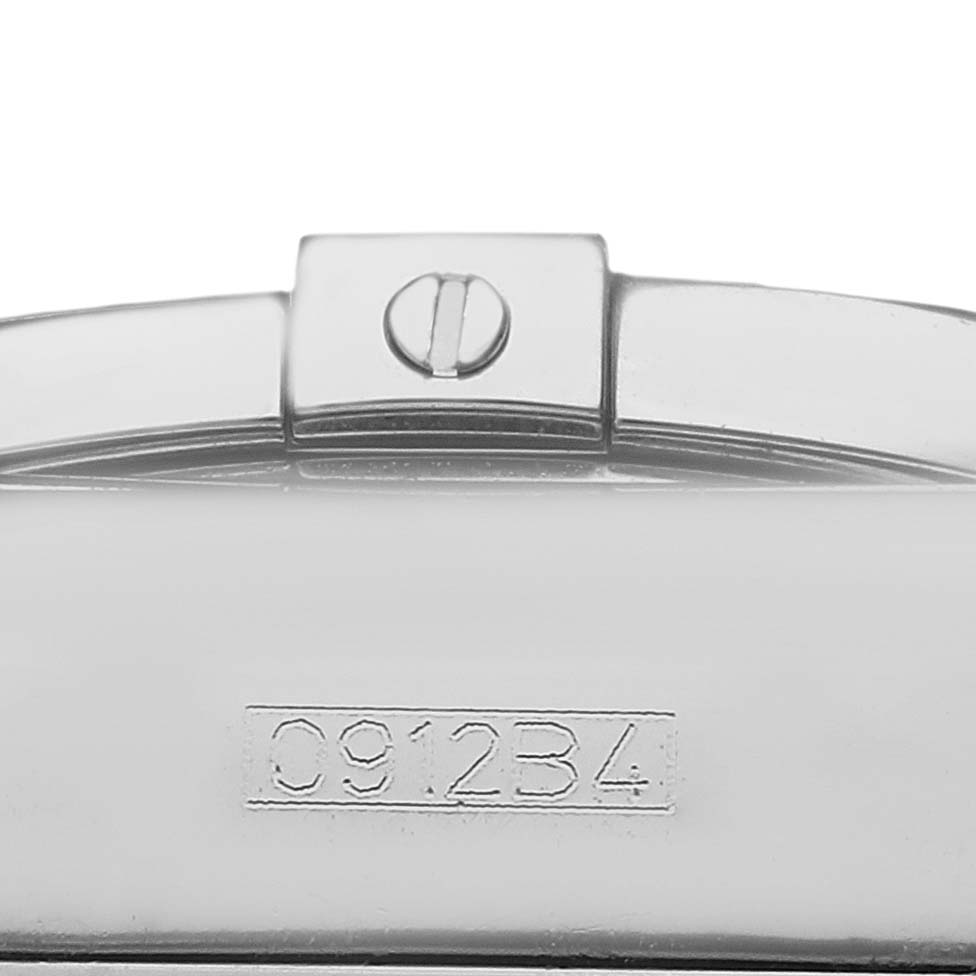 The image shows a close-up view of the clasp on a Breitling Chronomat AB0110 Men's Stainless Steel Mother of Pearl Dial watch bracelet, including a visible screw and serial number.