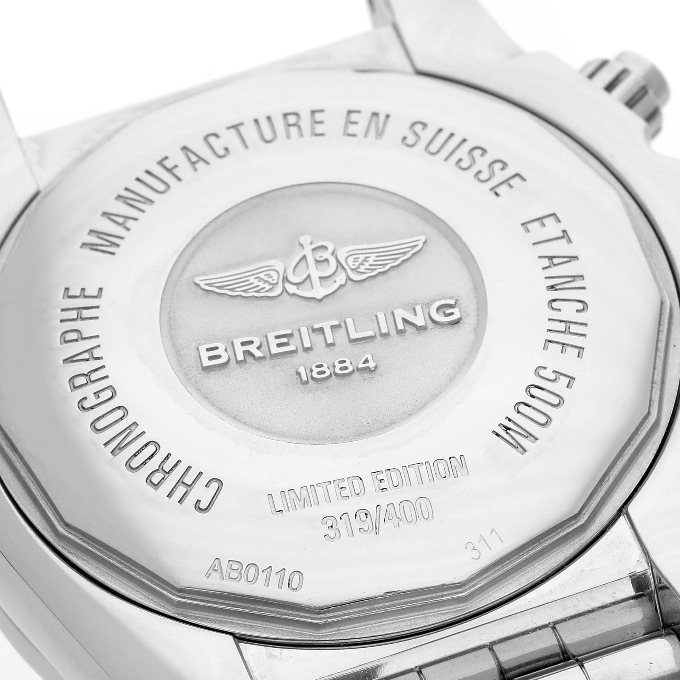The image shows the back case of a Breitling Chronomat AB0110 Men's Stainless Steel Mother of Pearl Dial watch, highlighting engraving details and the limited edition number.