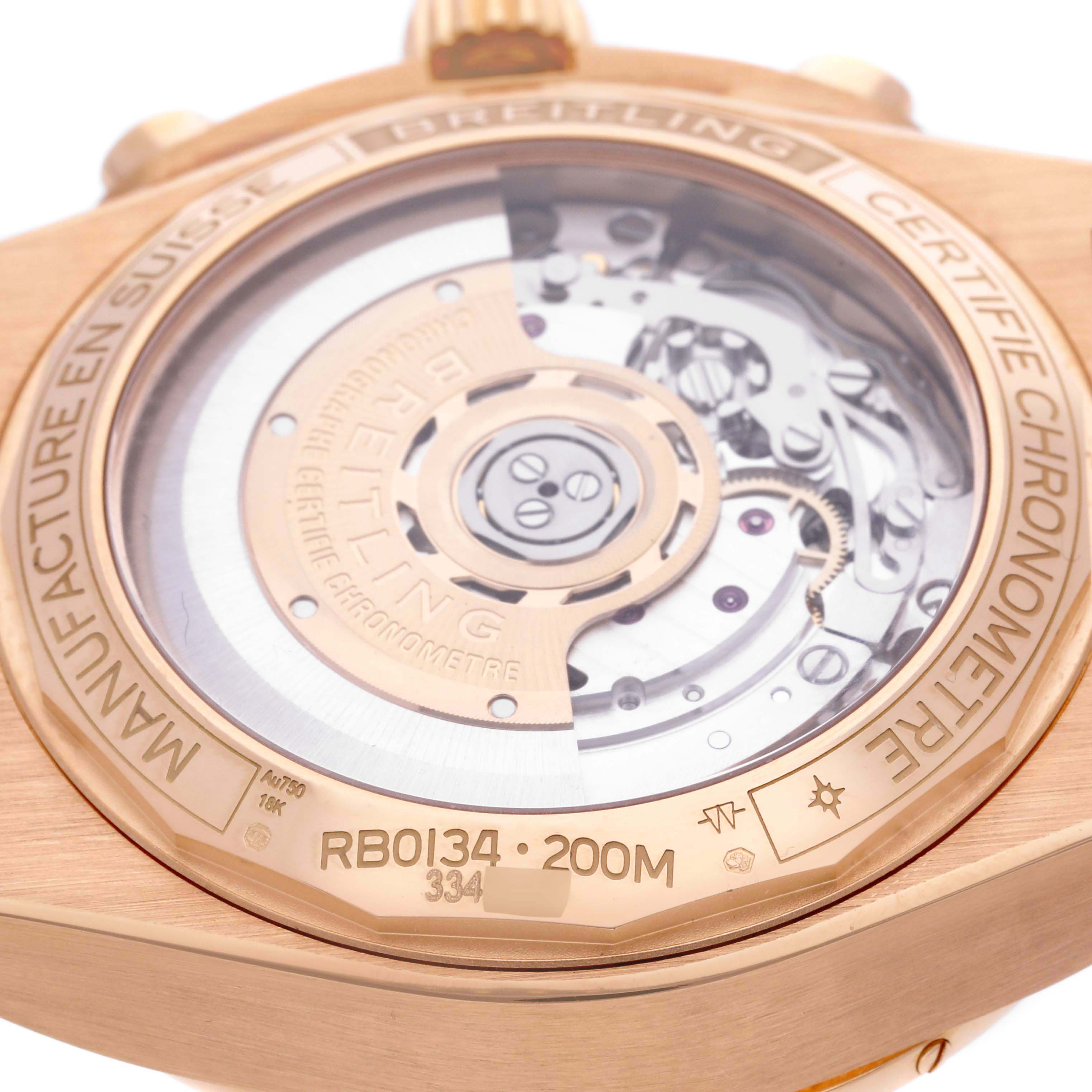 The image shows the back of a Breitling Chronomat RB0134 Men's Rose Gold Grey Dial RB0134 Men's Rose Gold Grey Dial watch, highlighting the automatic movement and engraving details.
