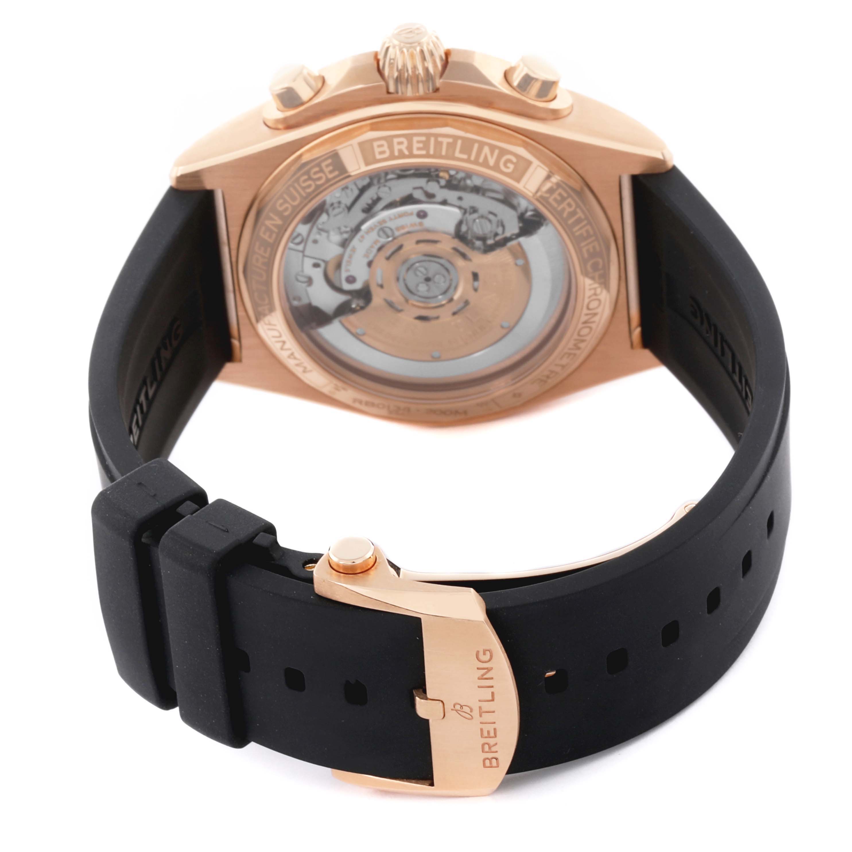 The Breitling Chronomat RB0134 Men's Rose Gold Grey Dial RB0134 Men's Rose Gold Grey Dial watch is shown from the back, highlighting the movement and the clasp on the rubber strap.
