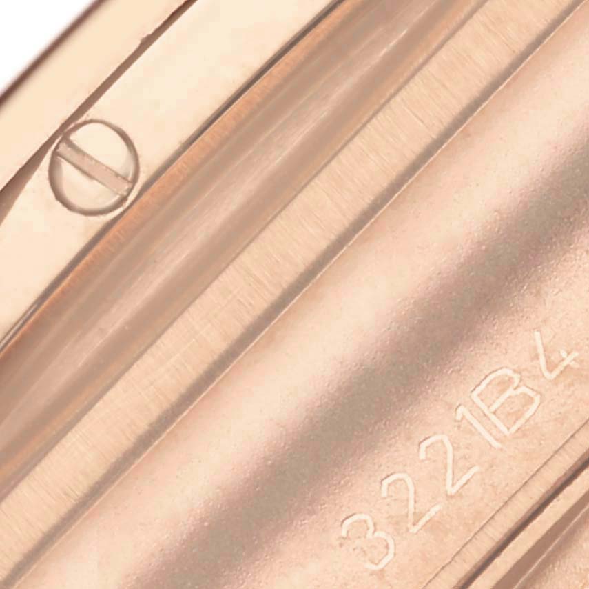 The image shows a close-up of the Breitling Chronomat RB0134 Men's Rose Gold Grey Dial RB0134 Men's Rose Gold Grey Dial's side, highlighting a screw and engraved numbers.