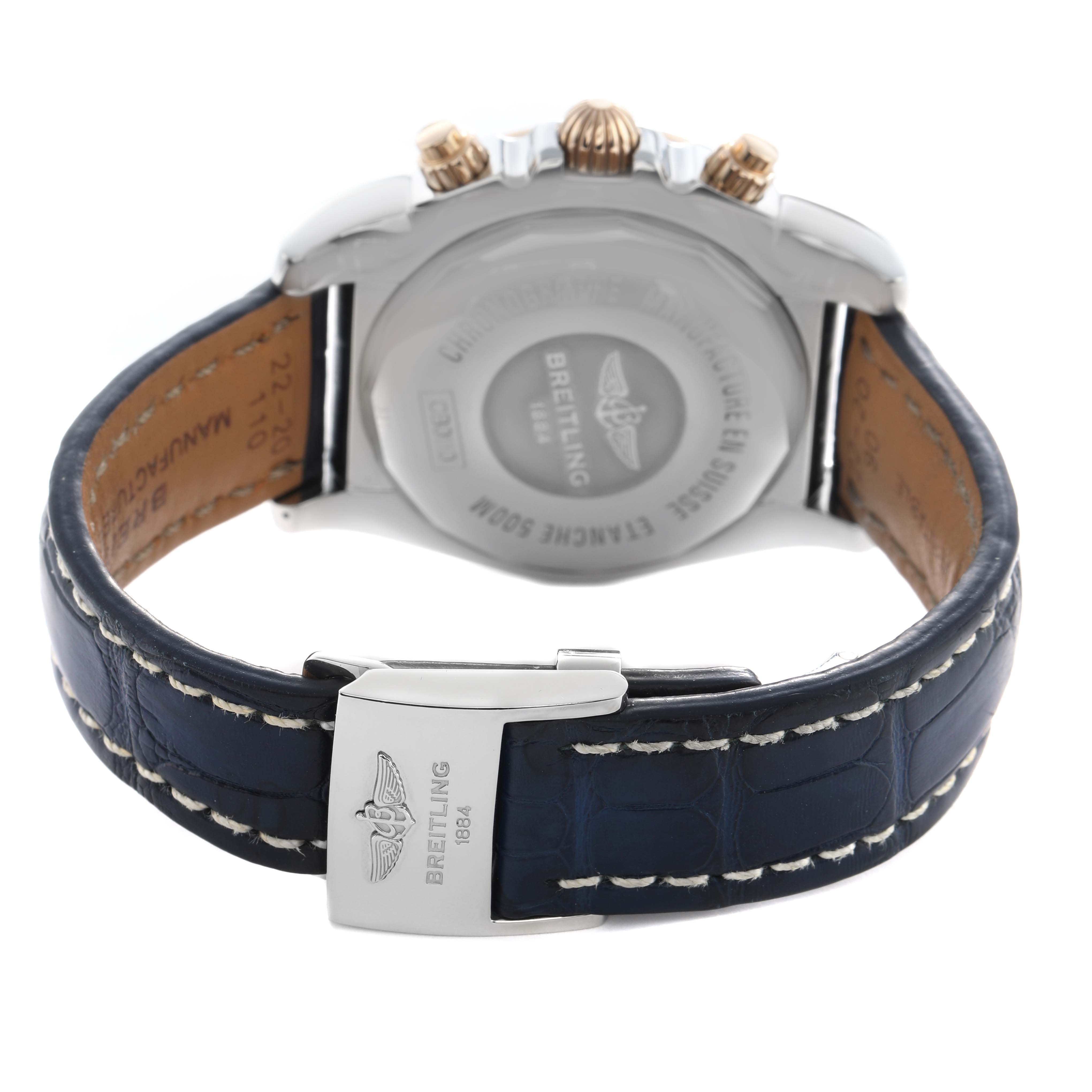 The image shows a rear view of the Breitling Chronomat CB0110 Men's Steel and Gold (two tone) Blue Dial, highlighting the case back, crown, pushers, and leather strap with a clasp.