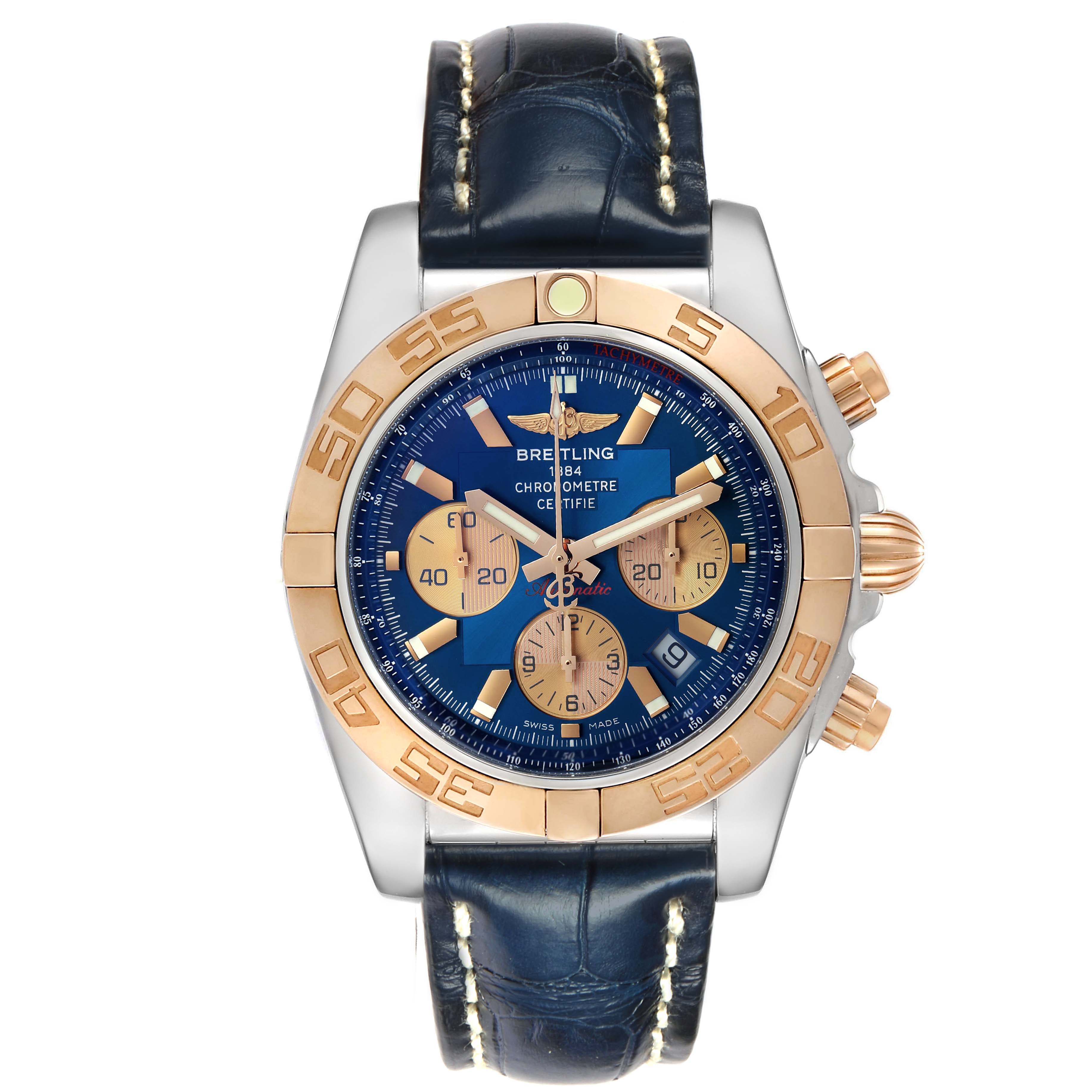 The Breitling Chronomat CB0110 Men's Steel and Gold (two tone) Blue Dial watch is shown from a top-down view, highlighting the blue dial, gold bezel, chronograph subdials, and leather strap.