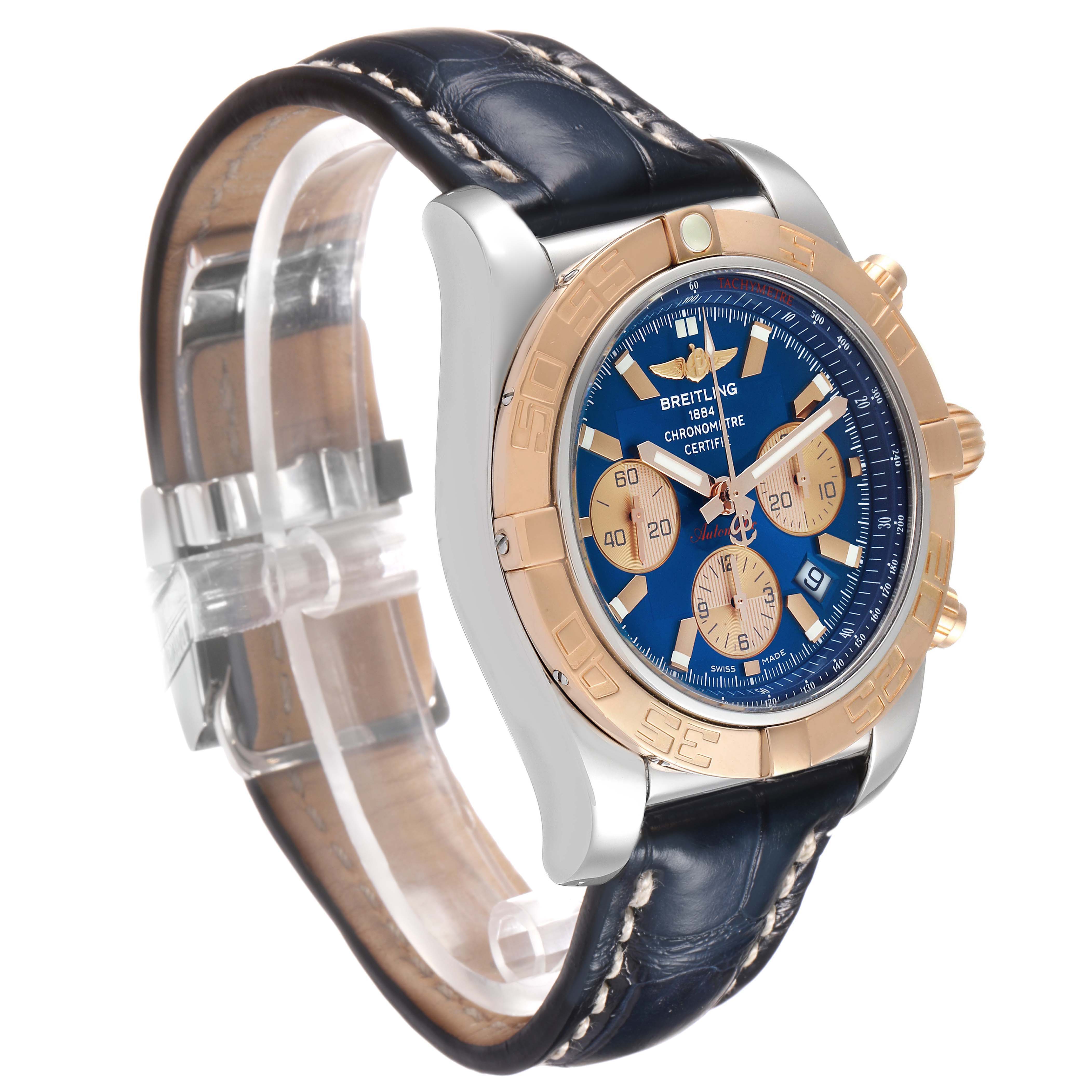 The Breitling Chronomat CB0110 Men's Steel and Gold (two tone) Blue Dial watch is shown at a three-quarter angle, highlighting the blue dial, rose gold bezel, and leather strap.