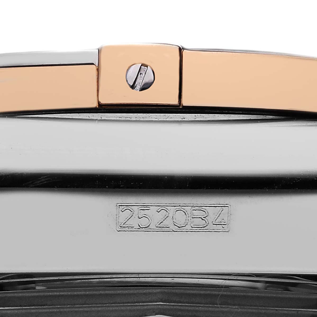 The image shows a close-up of the clasp and serial number of a Breitling Chronomat CB0110 Men's Steel and Gold (two tone) Blue Dial watch.