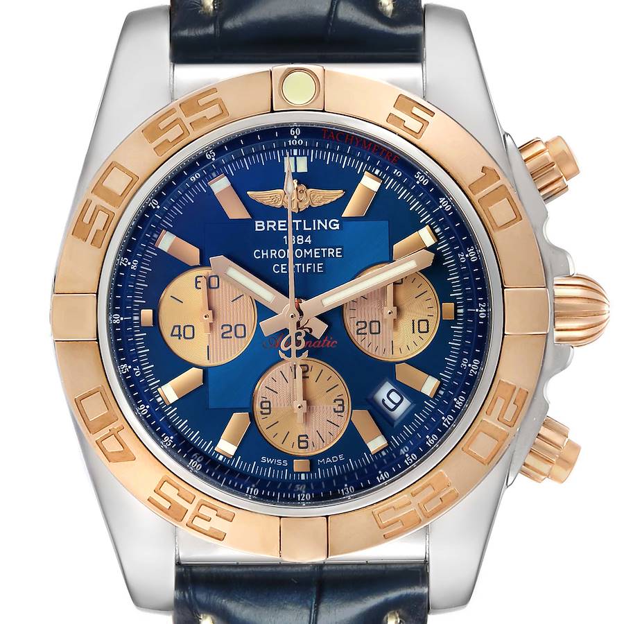 The Breitling Chronomat CB0110 Men's Steel and Gold (two tone) Blue Dial watch is shown from a front angle, highlighting its blue dial, gold bezel, and chronograph subdials.