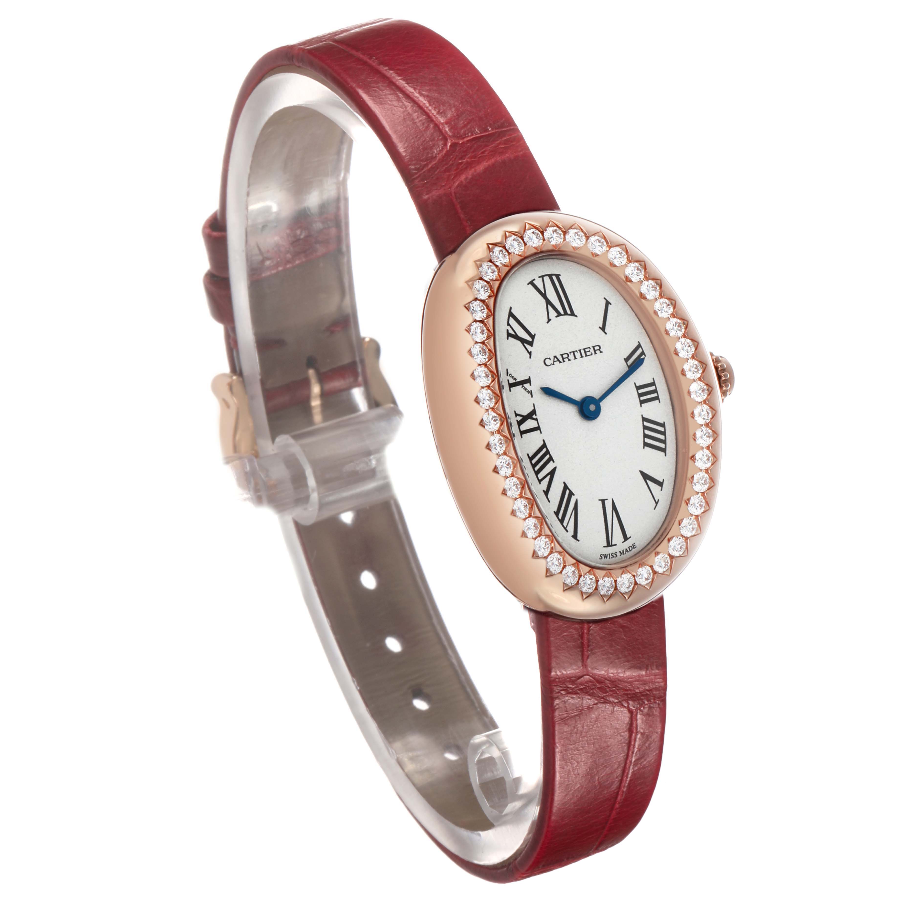 The Cartier Baignoire WJBA0031 Women's Rose Gold Silver Dial watch is shown at a three-quarter angle, displaying the face, diamond bezel, and red leather strap.