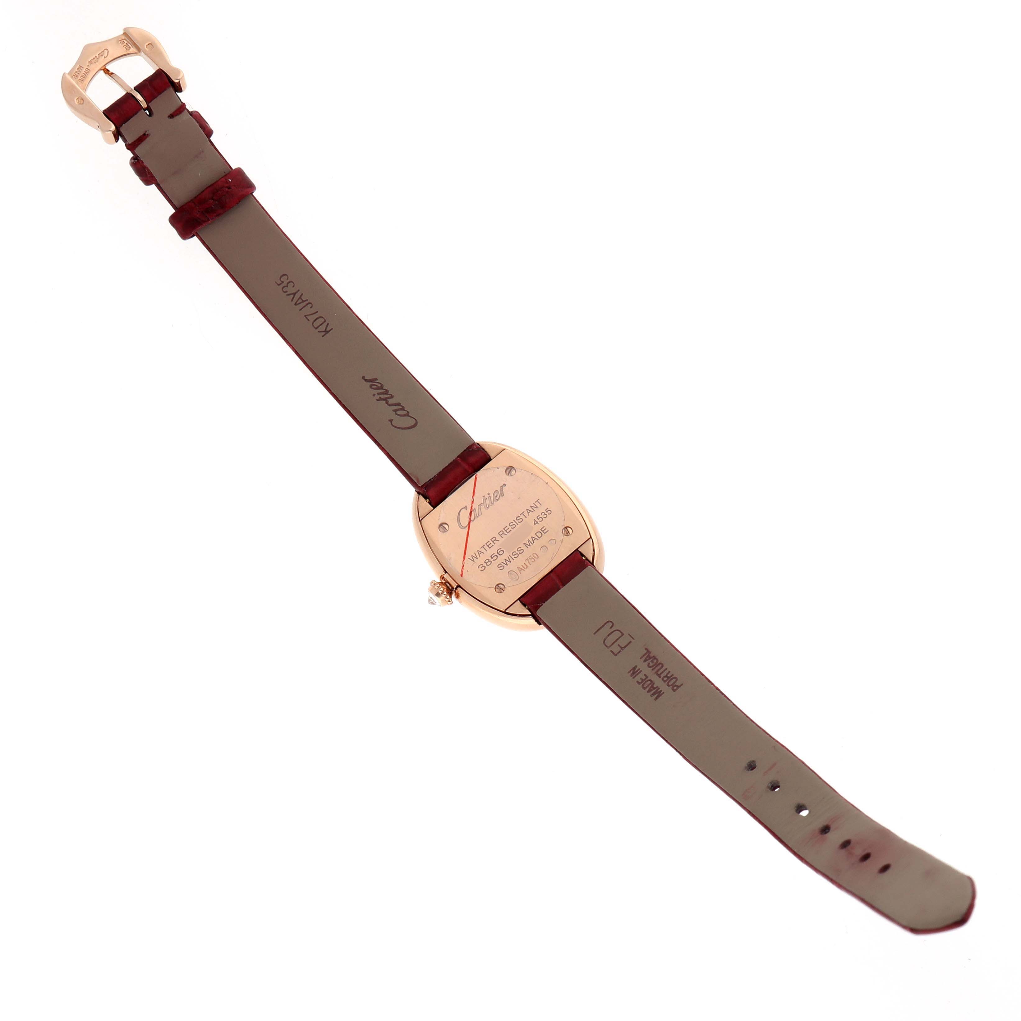 The image shows the backside of a Cartier Baignoire WJBA0031 Women's Rose Gold Silver Dial watch, highlighting the case back and leather strap.