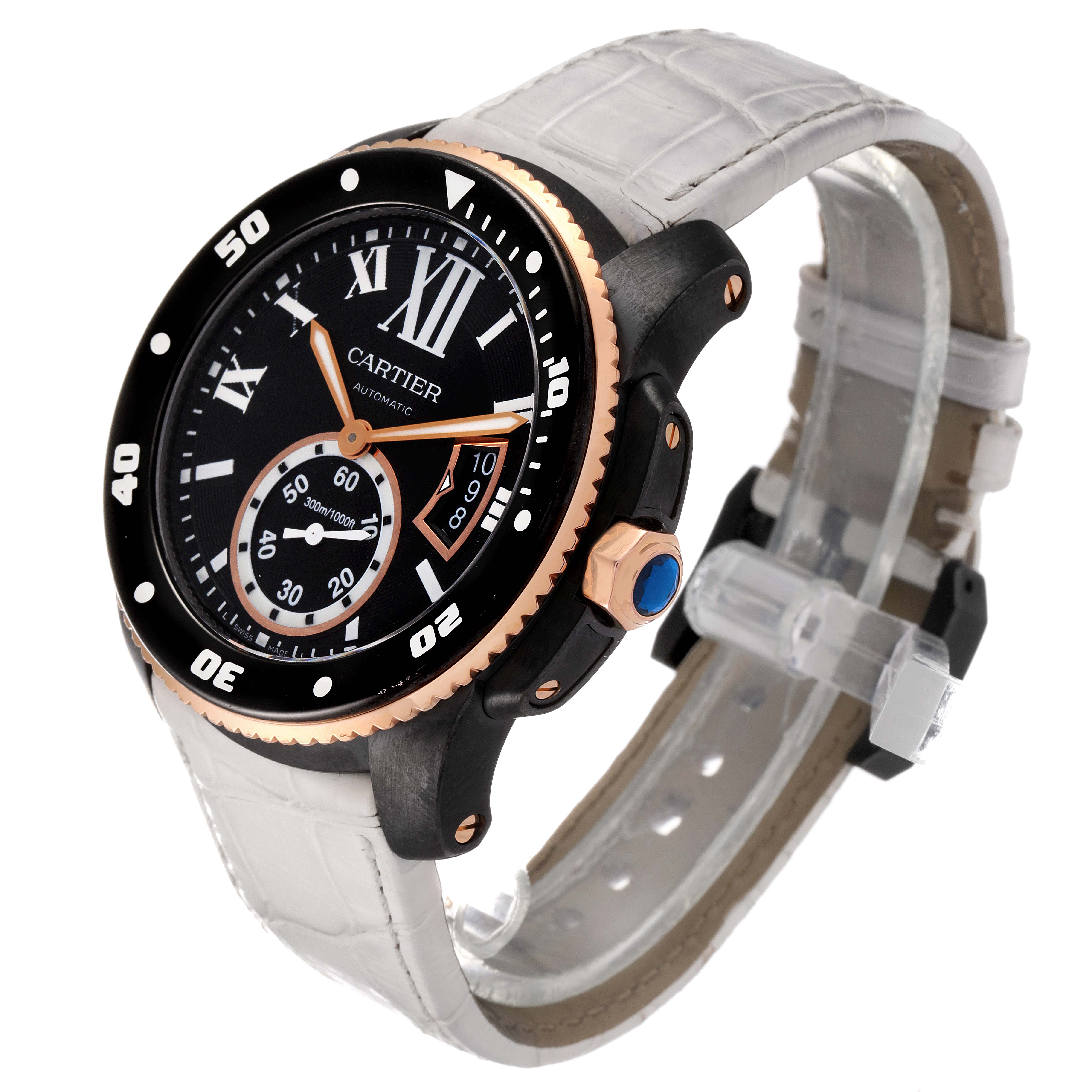 The Calibre de Cartier watch is shown from an oblique angle, highlighting its dial, bezel, crown, and strap.