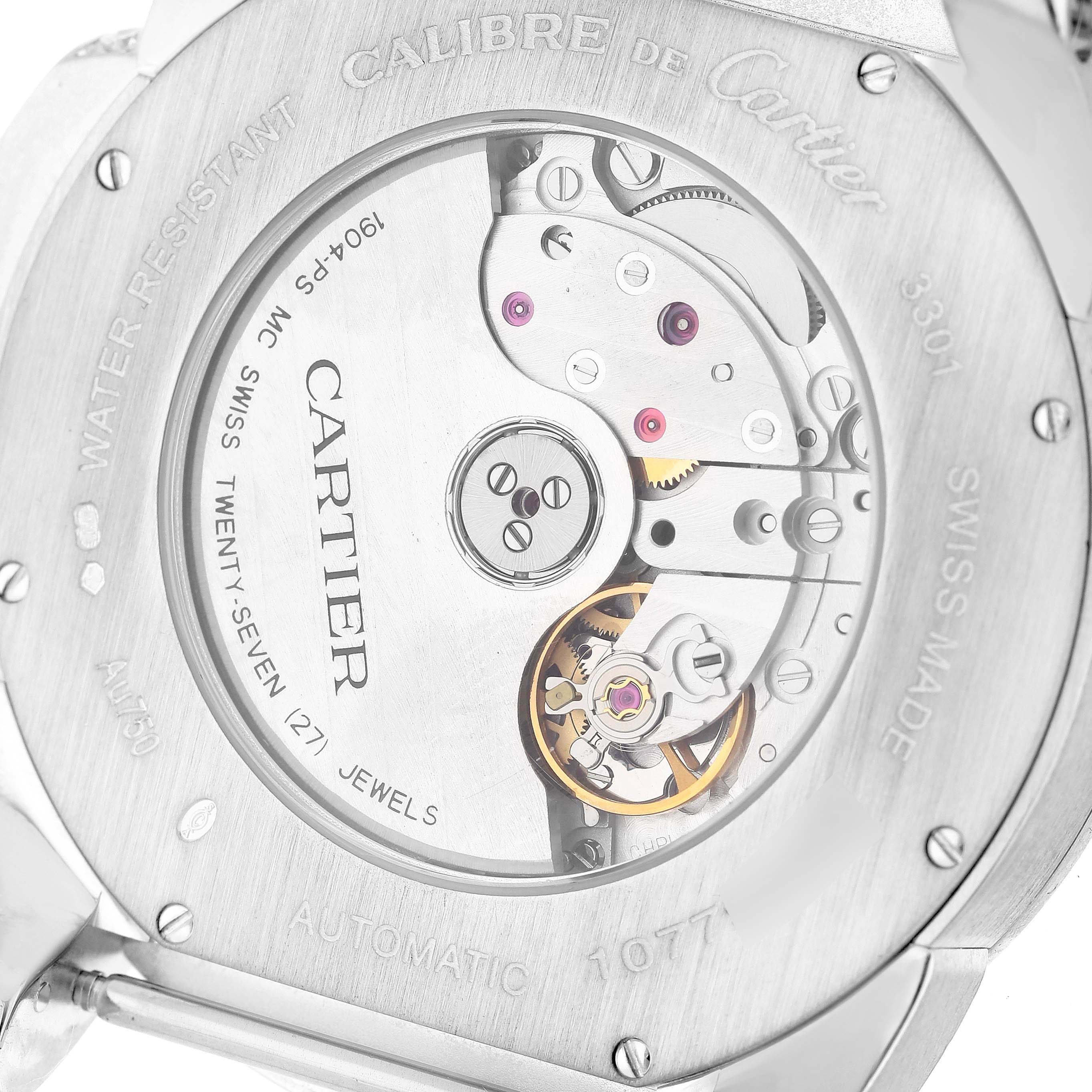 This image shows the back view of the Calibre de Cartier watch by Cartier, highlighting its movement and internal mechanics.