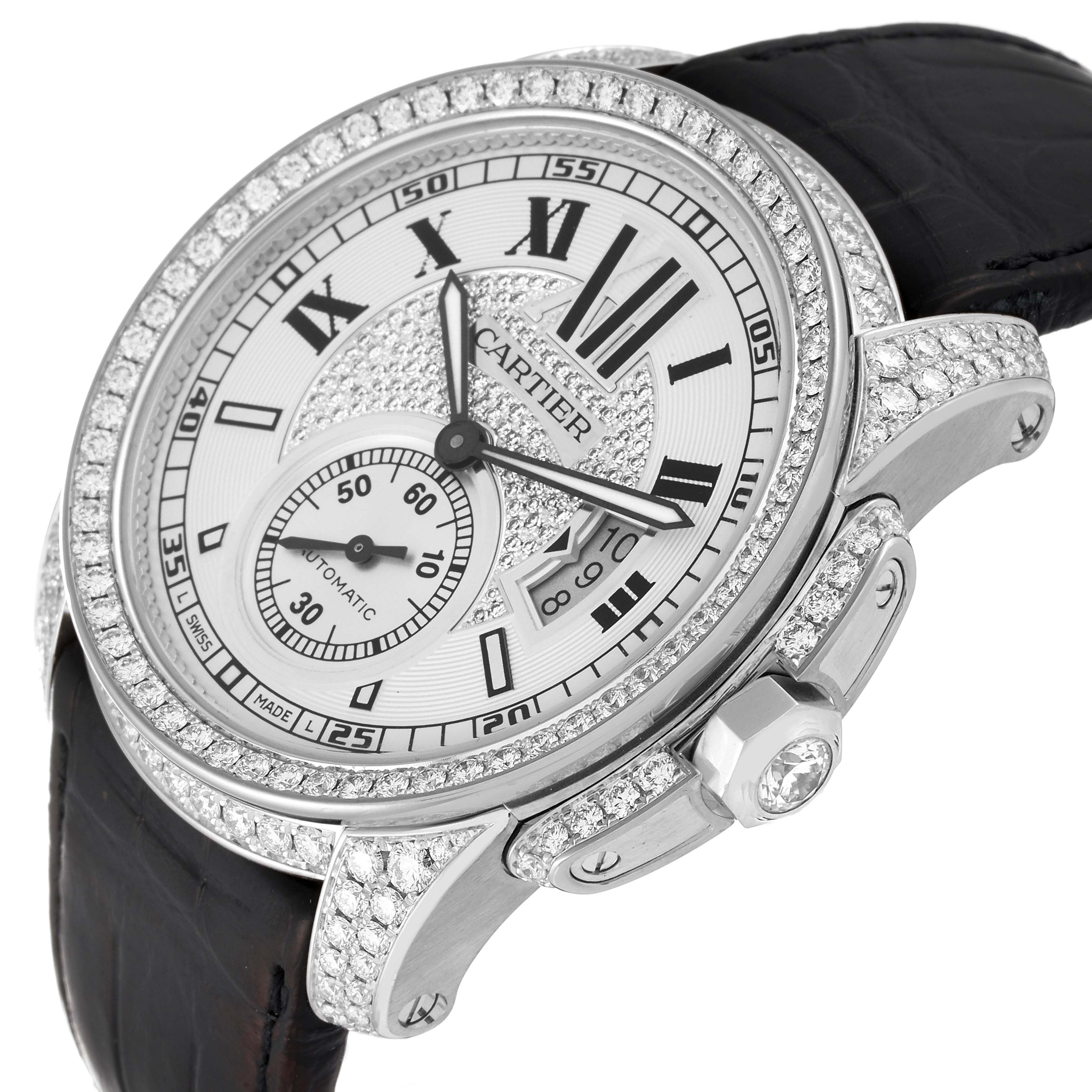 The image shows the dial, bezel, crown, and part of the strap of a Calibre de Cartier watch by Cartier.