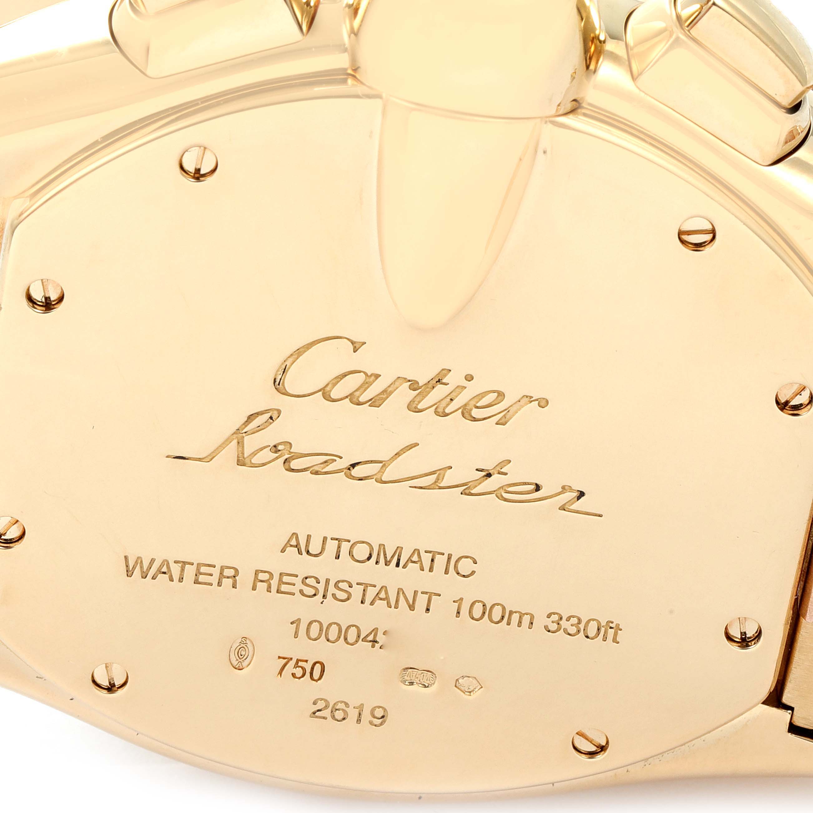 This image shows the back case of a Cartier Roadster W62021Y2 Men's Yellow Gold  W62021Y2 Men's Yellow Gold  watch, emphasizing its engravings and markings.