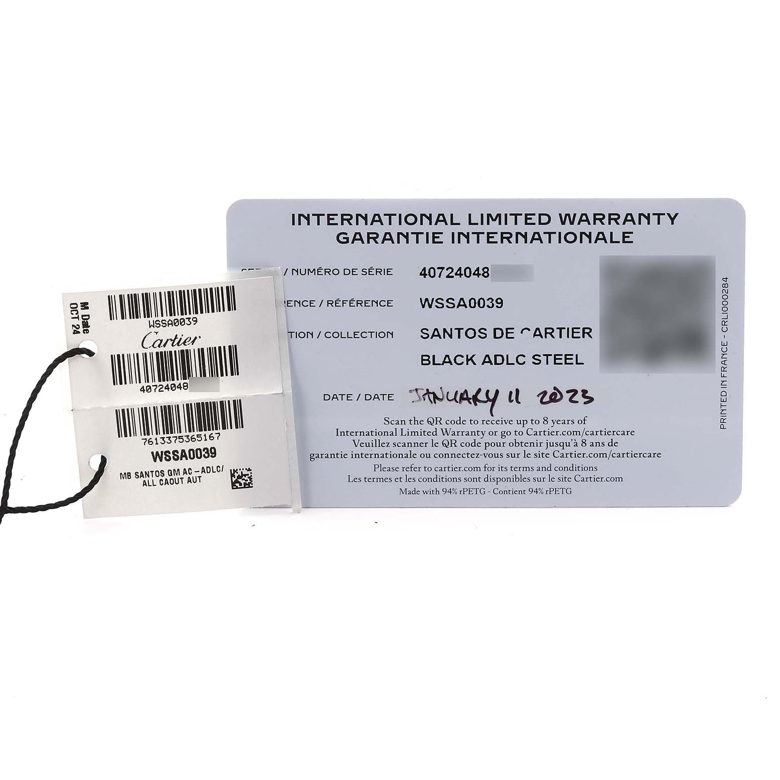 The image shows the International Limited Warranty card and tag for the Cartier Santos WSSA0039 Men
s Stainless Steel Black Dial WSSA0039 Men
s Stainless Steel Black Dial model.