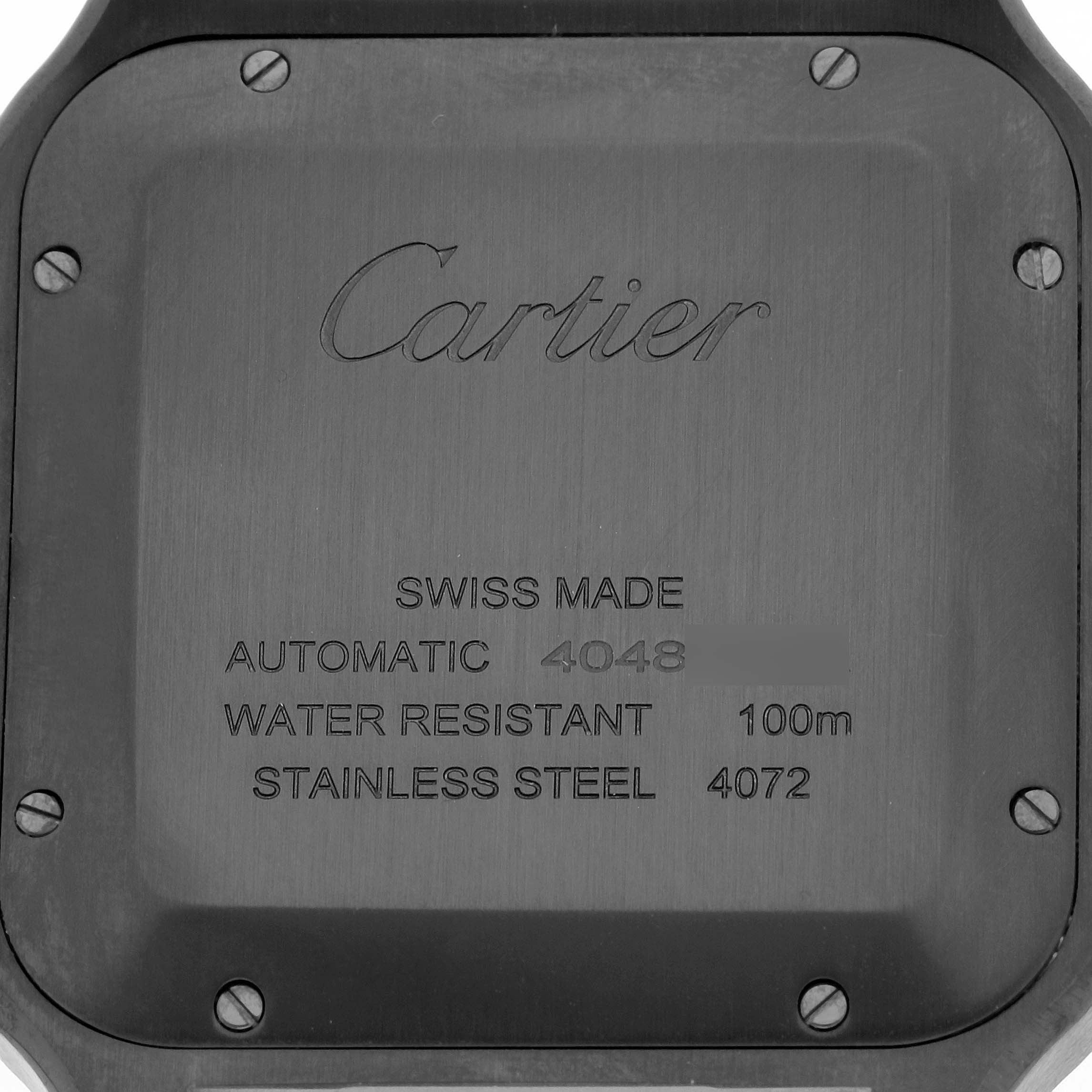 The image shows the back of a Cartier Santos WSSA0039 Men
s Stainless Steel Black Dial WSSA0039 Men
s Stainless Steel Black Dial watch, highlighting its engraving and screws.