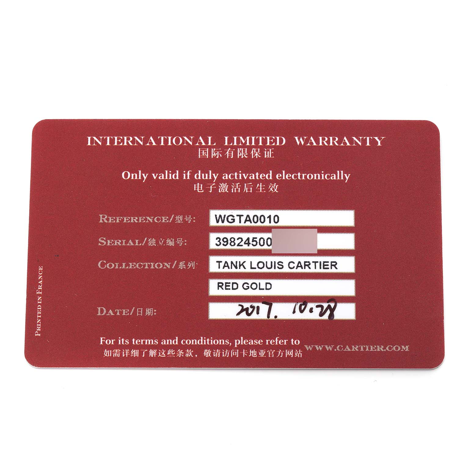 This is an international limited warranty card for the Tank Louis model by Cartier, shown from an overhead angle.