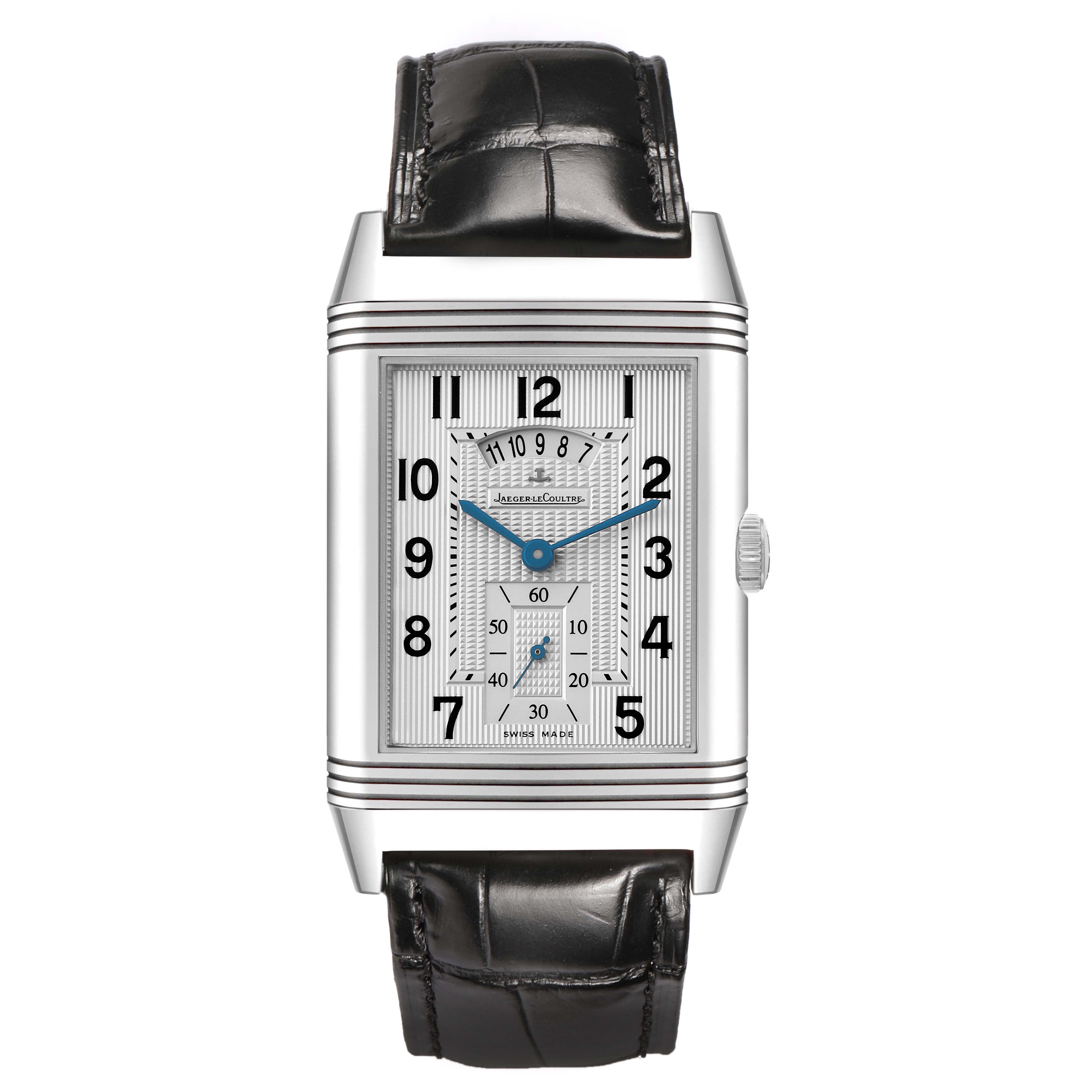 The Jaeger-LeCoultre Reverso watch is shown from a front view, displaying its rectangular face, numerals, and black leather strap.