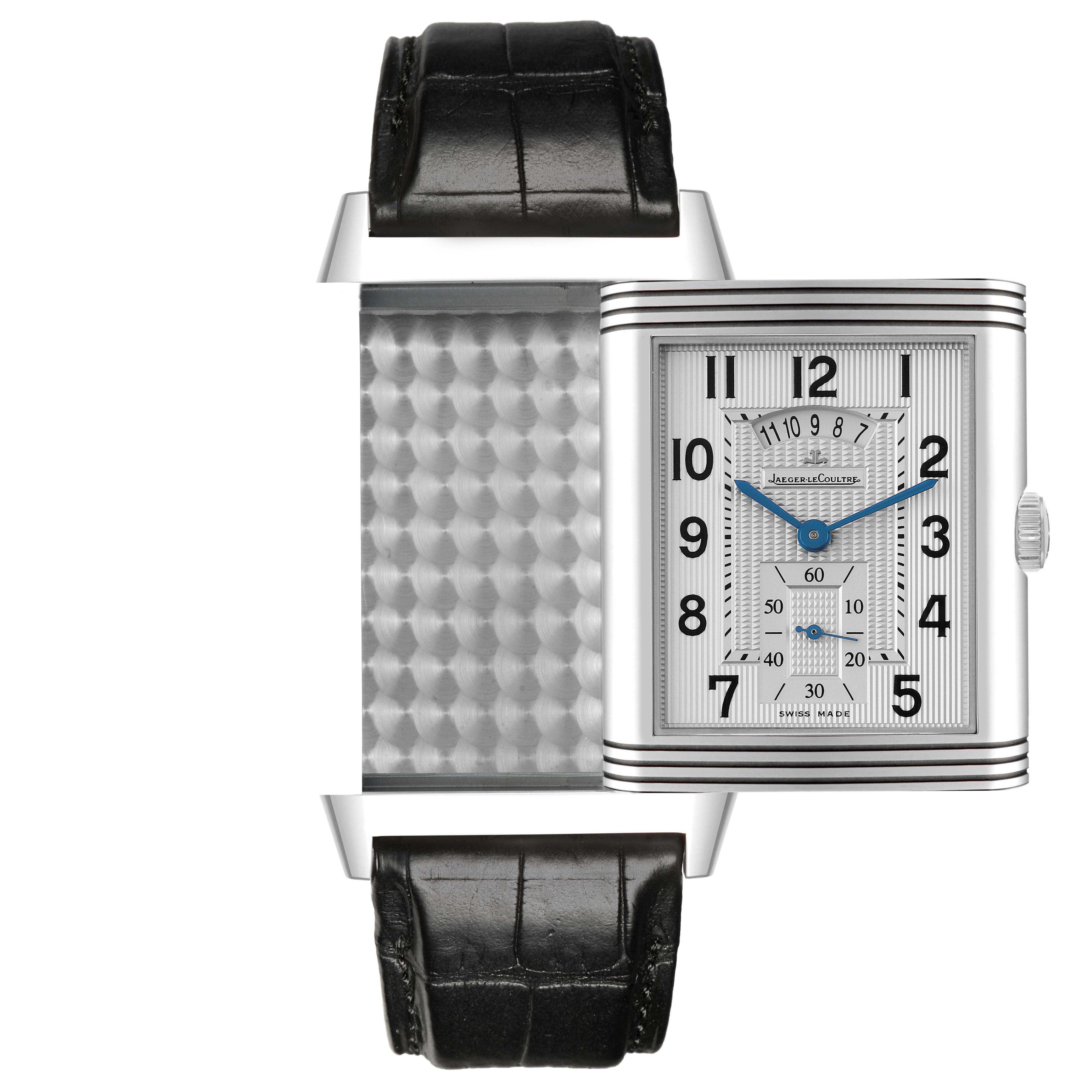 The Jaeger-LeCoultre Reverso watch is shown in a frontal view, displaying its dial and unique reversible case with a visible strap.