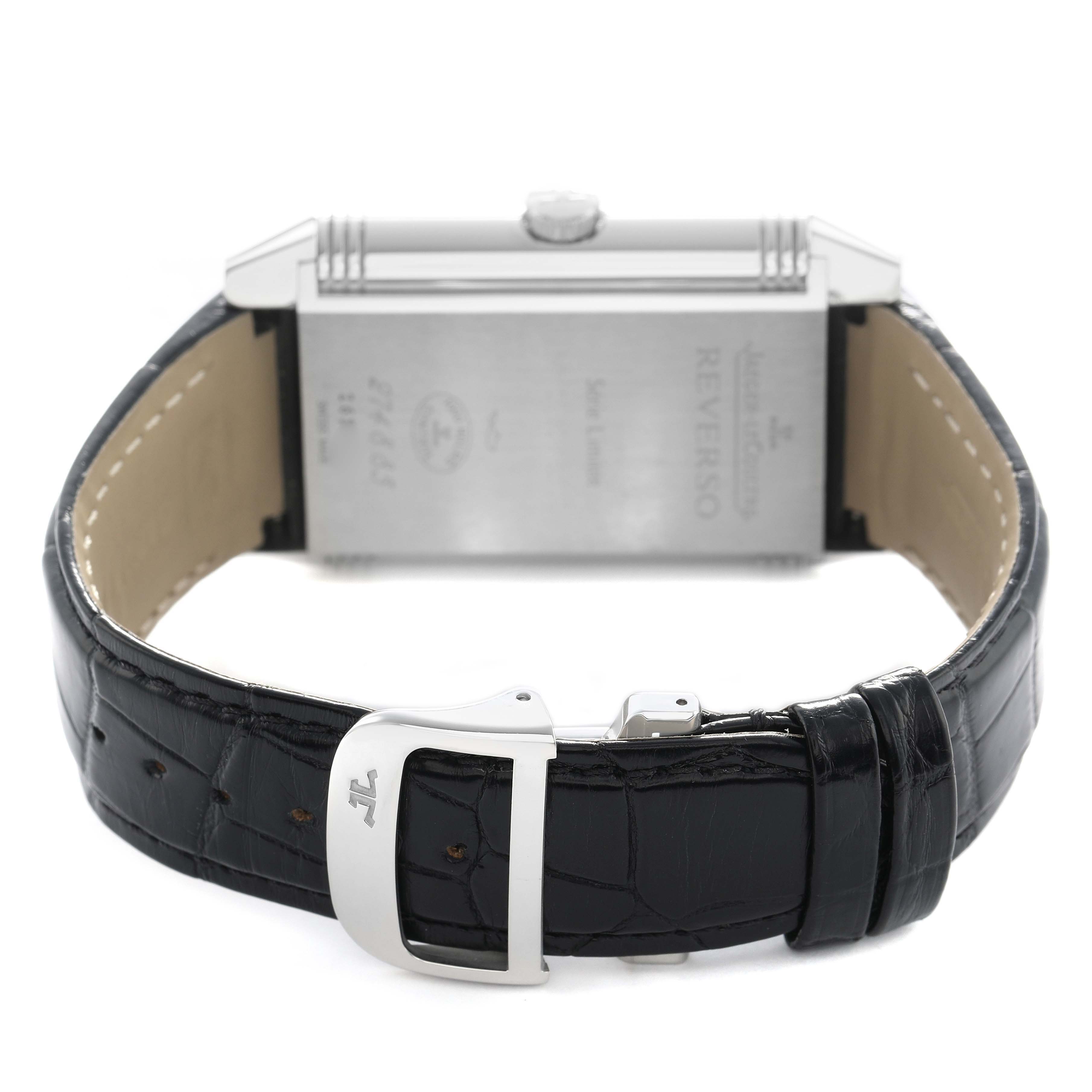 The image shows the back of the Jaeger LeCoultre Reverso 274.8.85 Men's Stainless Steel Silver Dial watch, highlighting the case back, crown, and black leather strap.