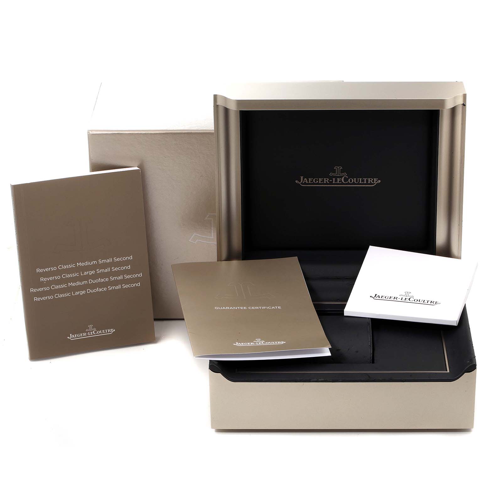 This image shows a Jaeger-LeCoultre Reverso watch box, guarantee certificate, and user manuals from a slightly angled view.