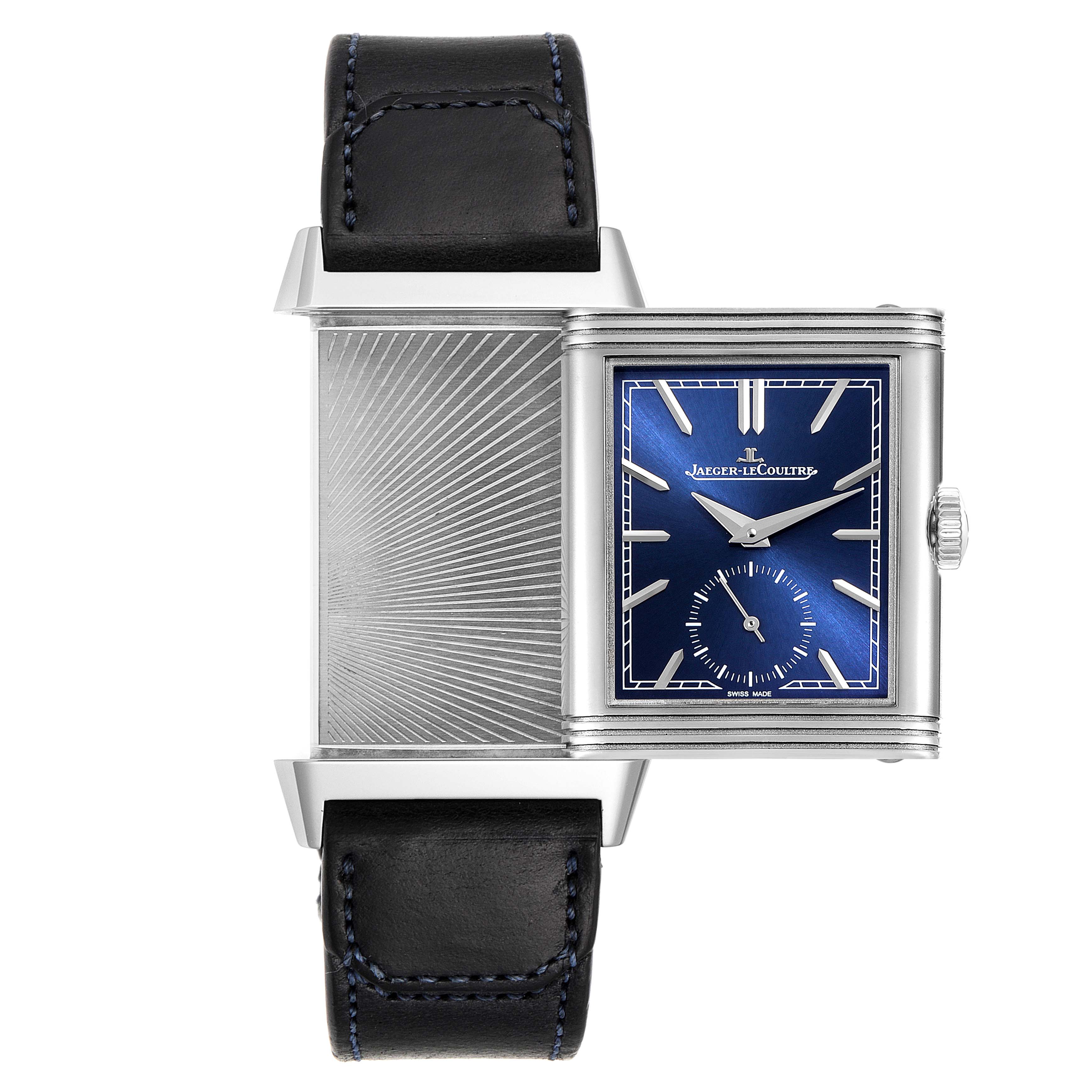 The image shows a Reverso watch by Jaeger LeCoultre with its case swiveled open to reveal a textured metal back and a blue dial.