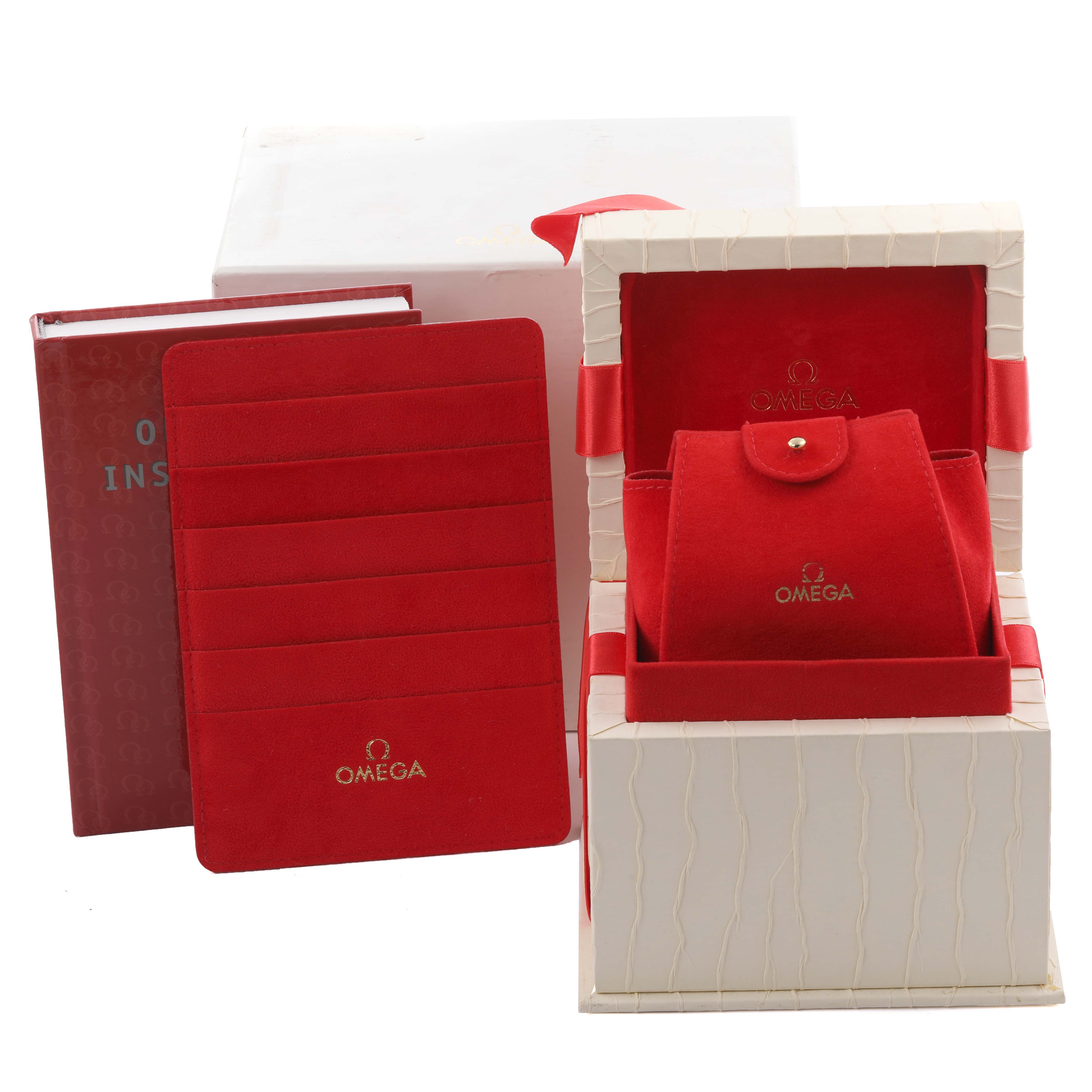 The image shows the packaging and accessories for the Omega 1267.75.00 Women's Steel and Gold (two tone) Mother of Pearl Dial 1267.75.00 Women's Steel and Gold (two tone) Mother of Pearl Dial Constellation 95 model, including a red box, pouch, and instruction manual.