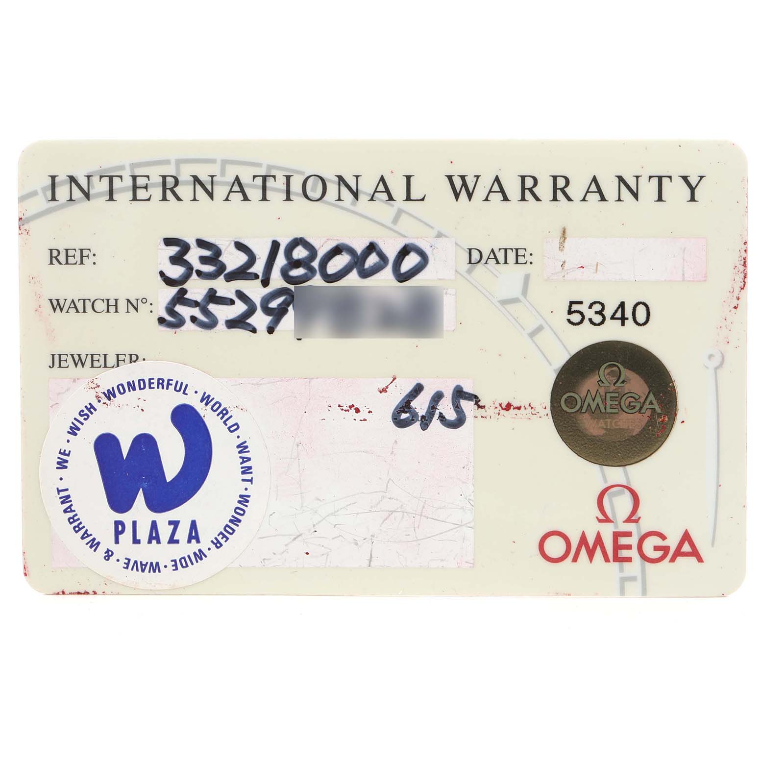 This image shows a close-up of an Omega Speedmaster 3321.80.00 Men's Steel and Gold (two tone) Blue Dial 3321.80.00 Men's Steel and Gold (two tone) Blue Dial international warranty card.