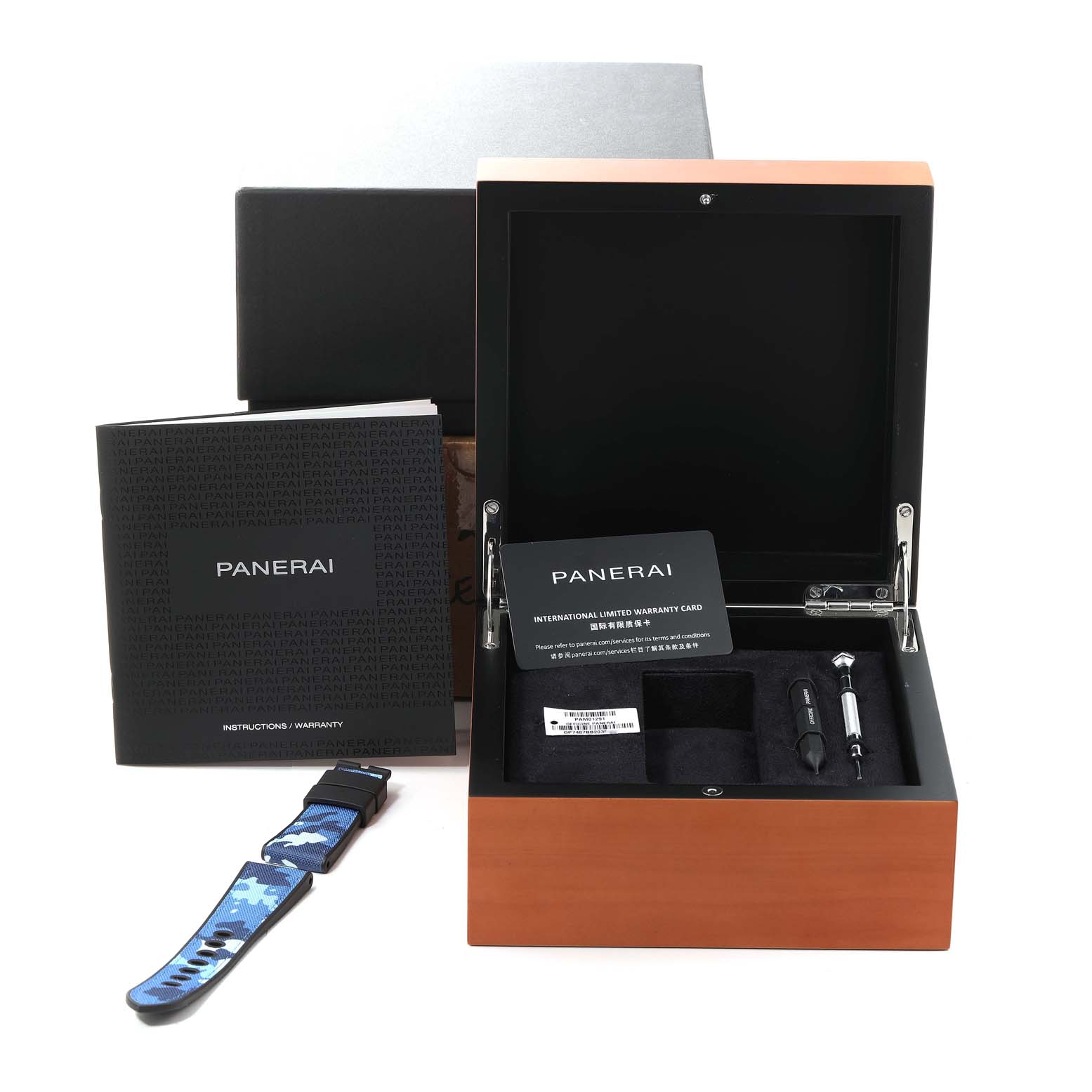 The image shows the Panerai Submersible PAM01291 Men's Titanium Blue Dial PAM01291 Men's Titanium Blue Dial watch box, a camouflage strap, warranty booklet, and a tool from an angled, top-down perspective.